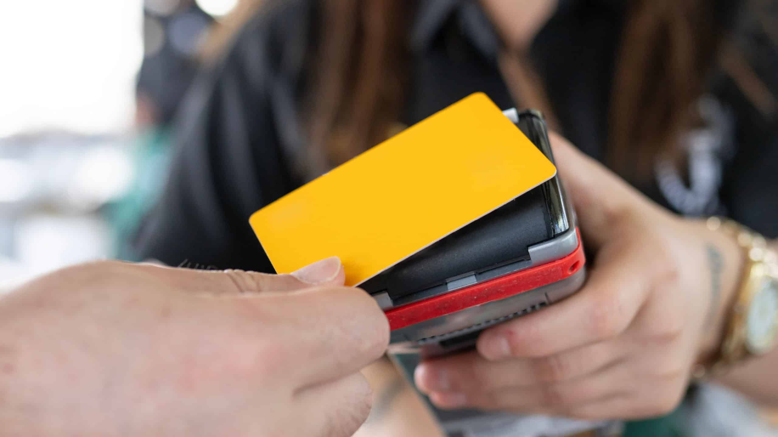 Close up of unrecognizable customer doing a contactless payment