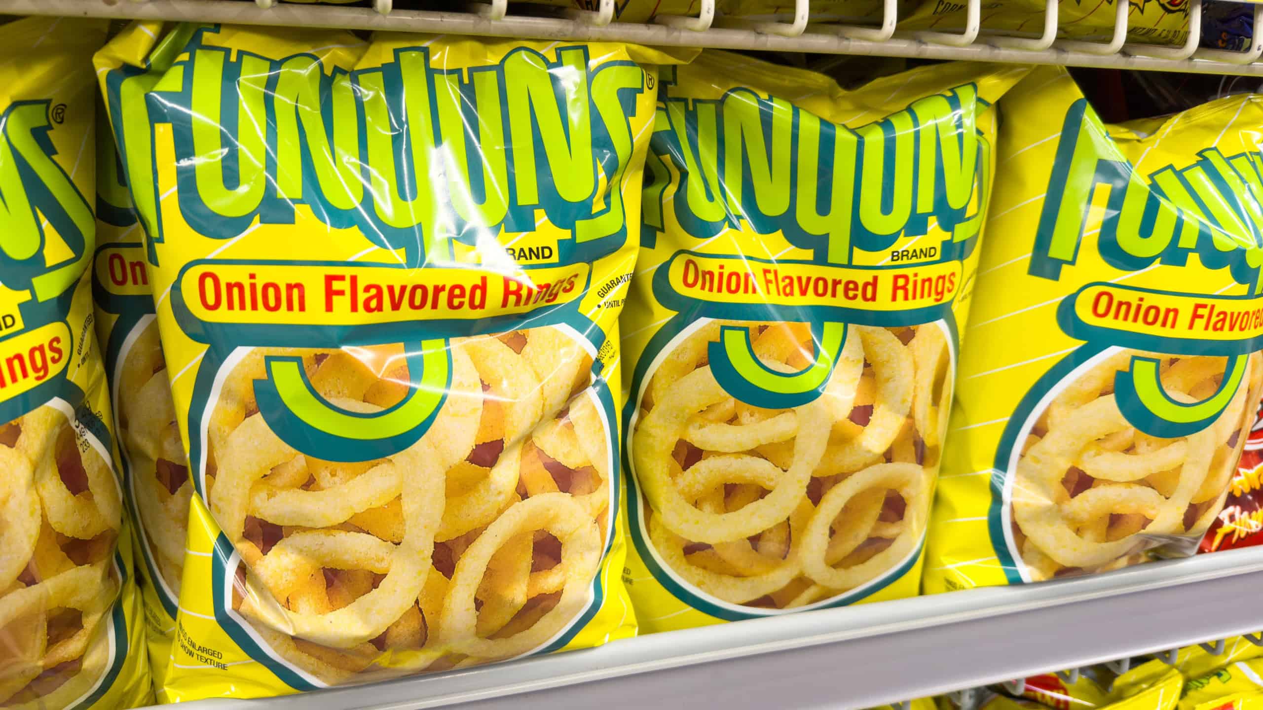 Los Angeles, CA - November 11, 2023: Large bags of Funyuns brand onion flavored rings on market shelf.