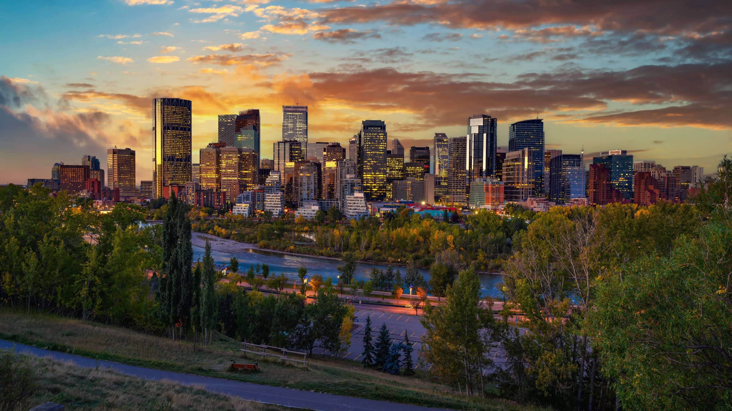 Sunset above city skyline of Calgary with Bow River, Alberta, Canada.