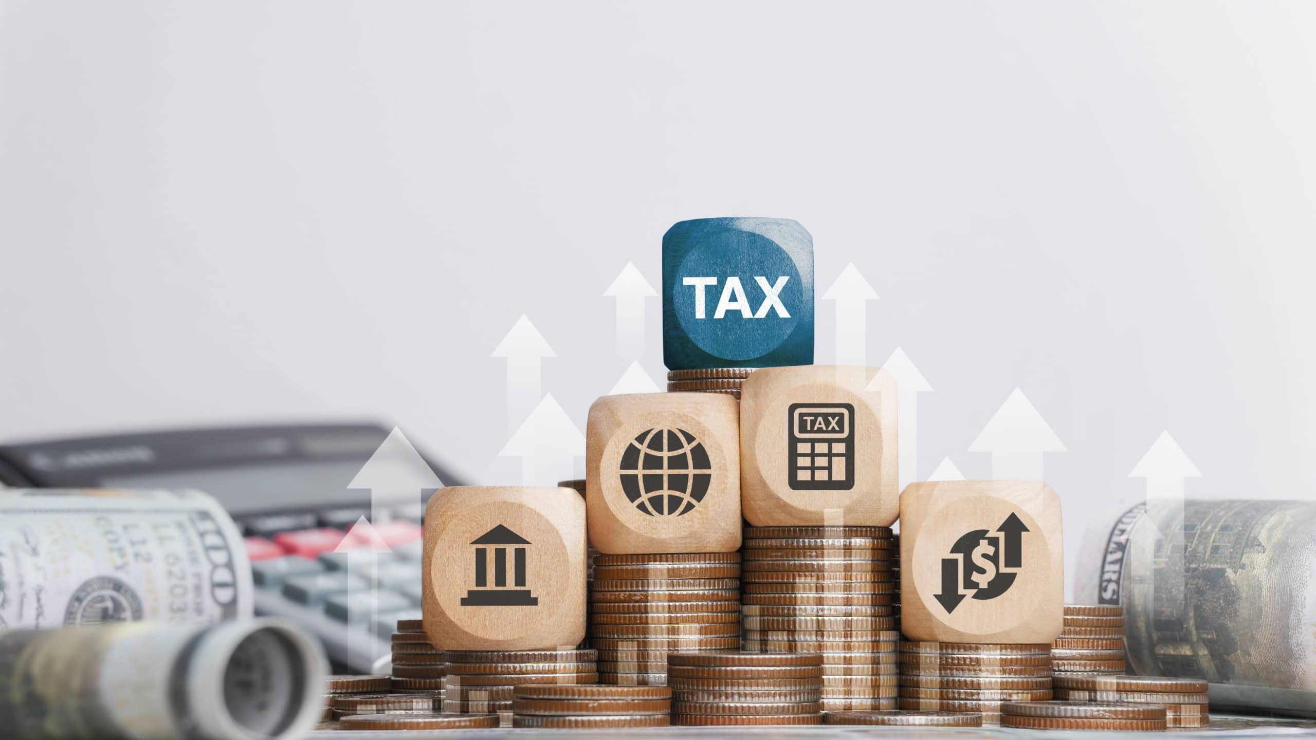 Tax concept with icons on wooden blocks Tax reduction planning, expenses, accounting, VAT and property taxes. Request a tax refund and submit taxes for online tax documents to the government.