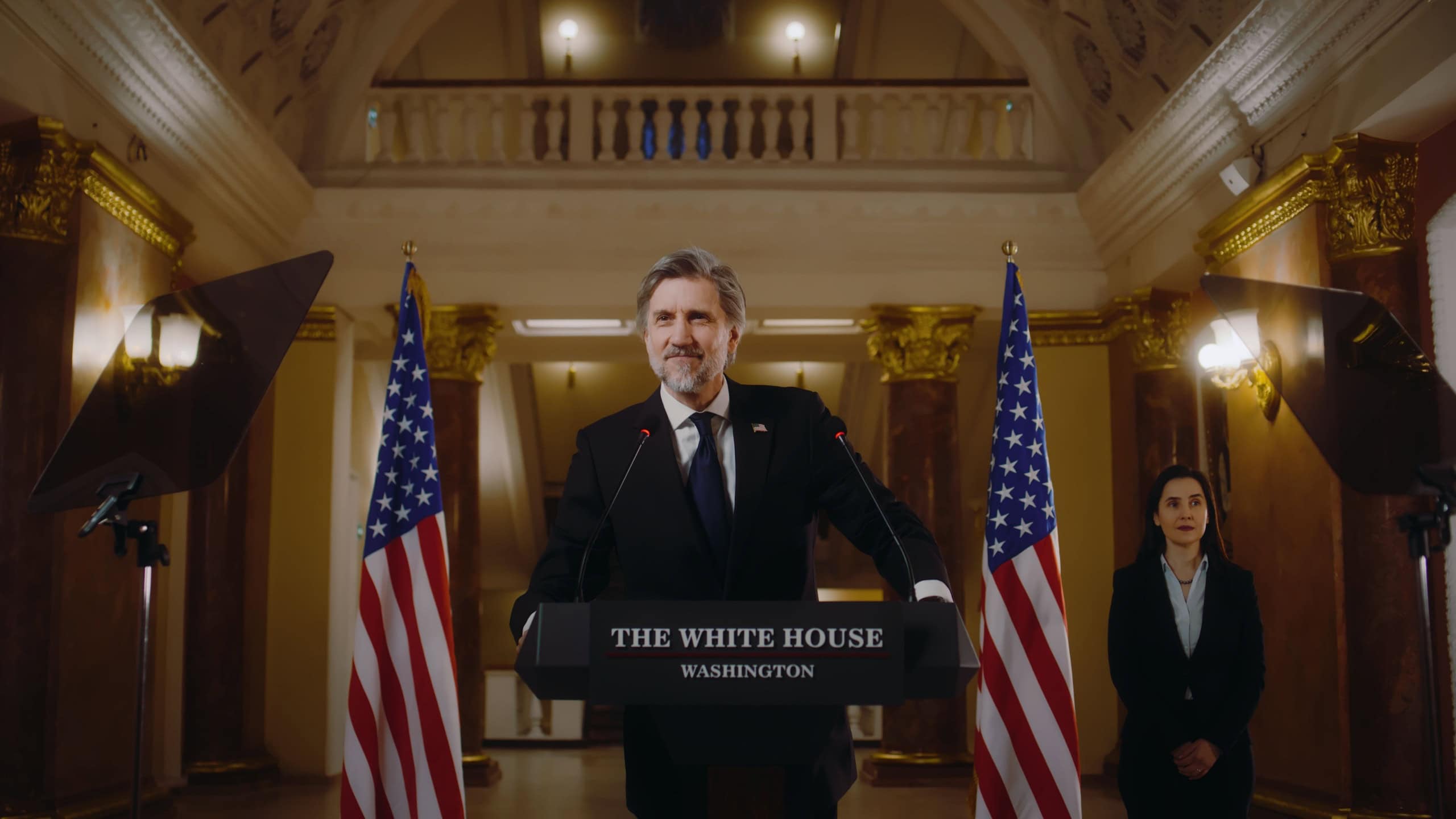 American republican politician during press conference in the White House. Confident US minister or congressman smiles, poses for cameras after political speech. USA flags in background. Slow motion.