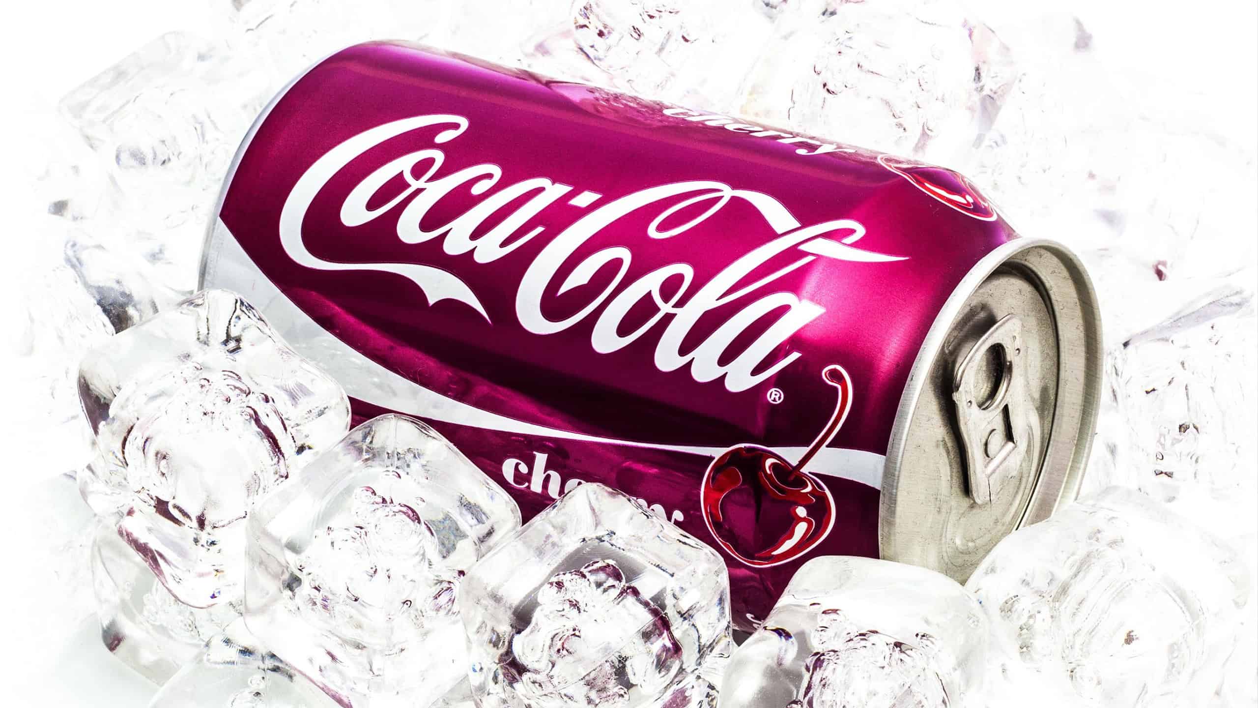 SWINDON, UK - JANUARY 24, 2015: Can of Cherry Coca-Cola on Ice over a white background