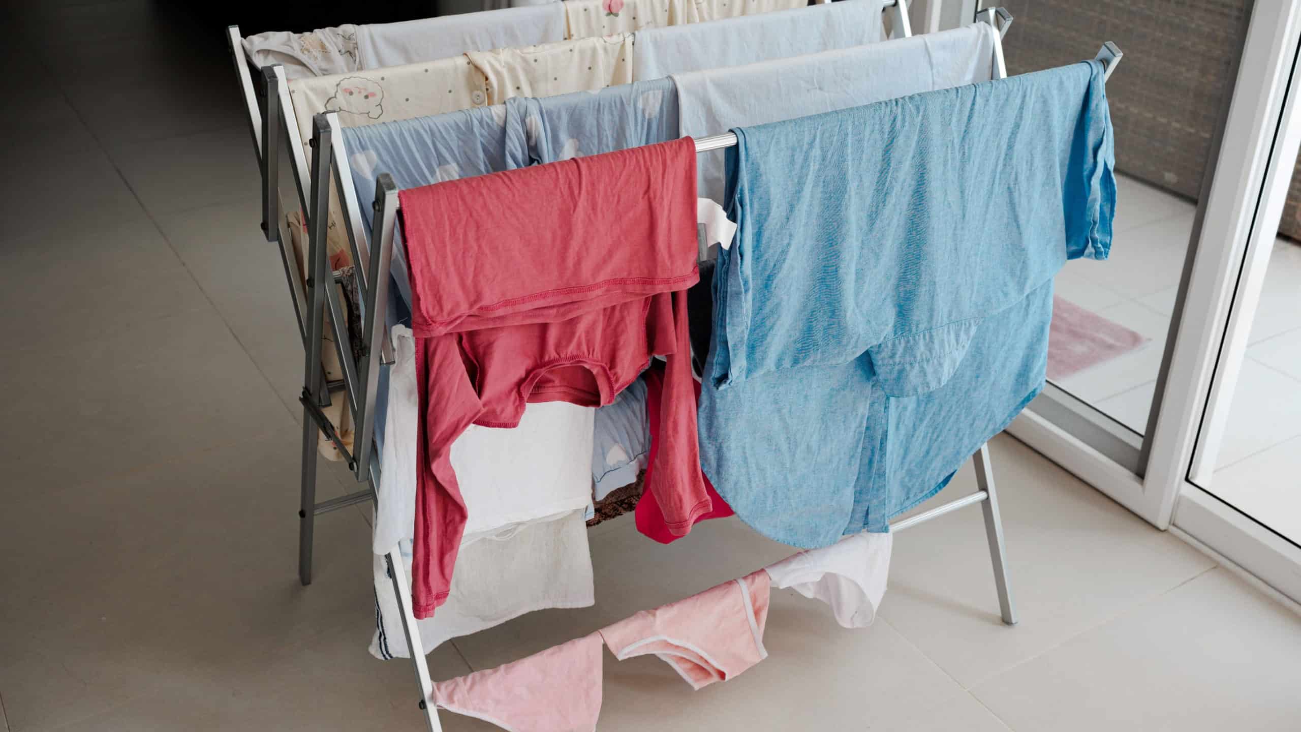 Clothes dryer with wet linen at home.