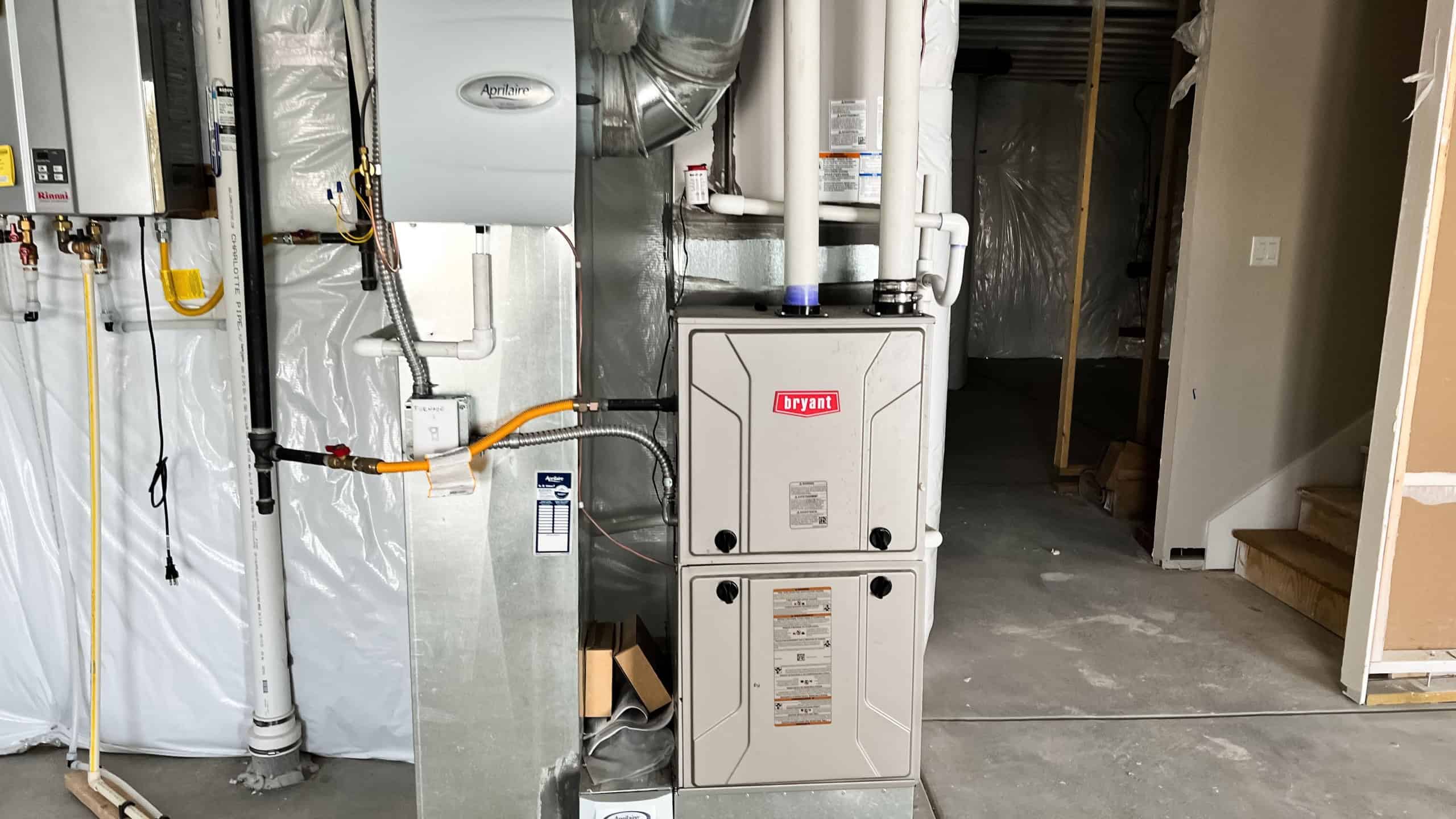 Castle Rock, Colorado, USA-December 30, 2022-A newly installed HVAC system in the basement of a residential single-family house under construction in a suburban neighborhood. The setup includes