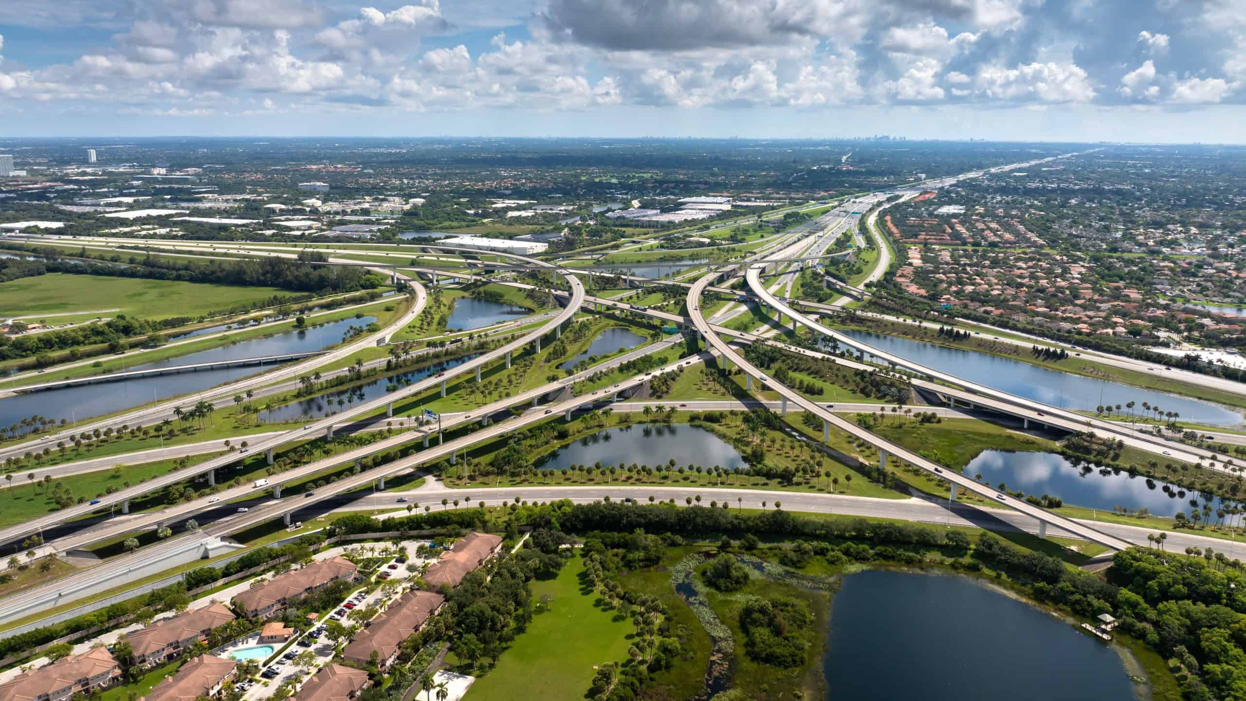 Complex highway overpass elevated direction lanes with busy traffic in Miami, Florida. American high speed road crossroads
