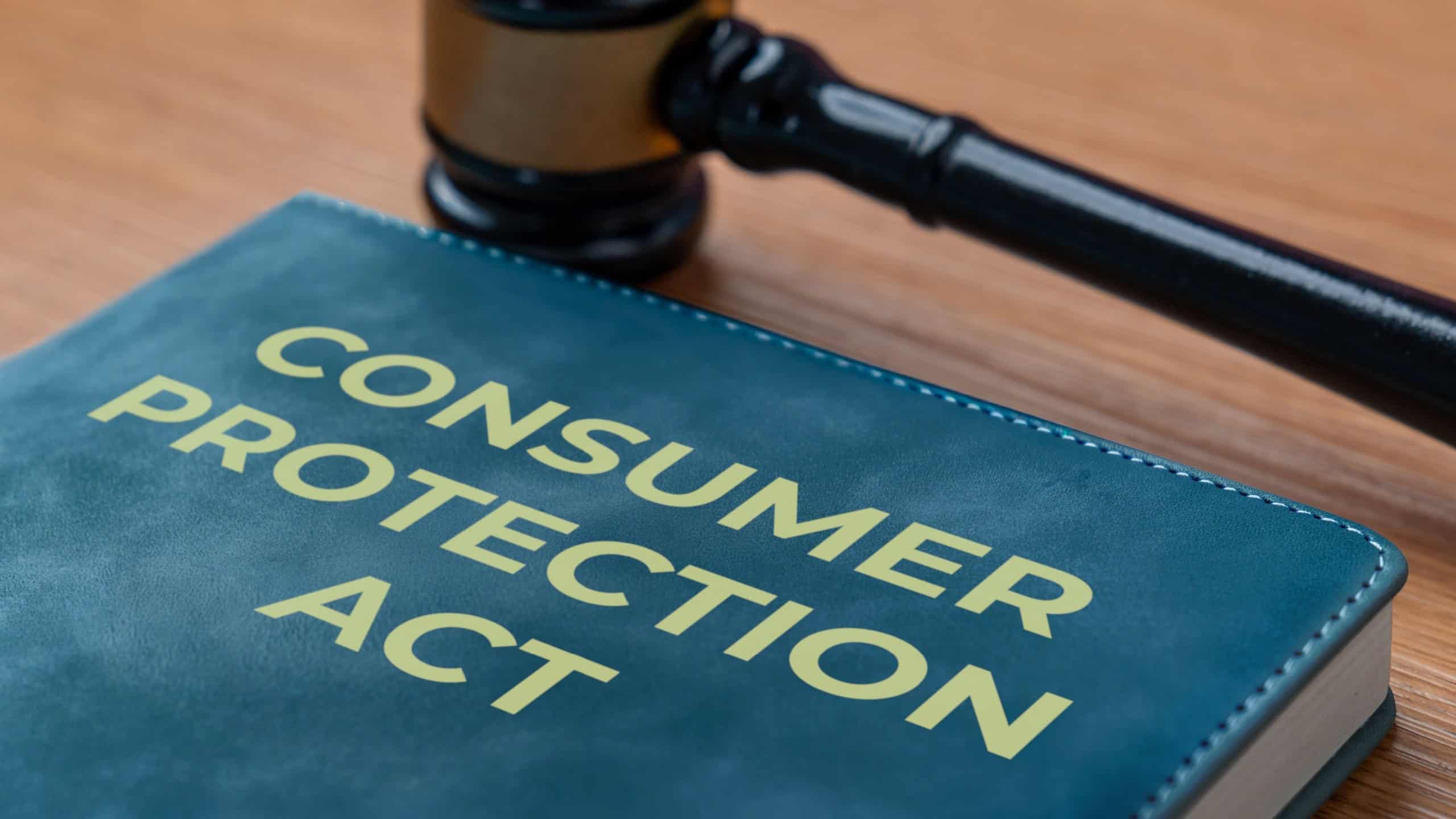 A book titled Consumer Protection Act and a gavel. Legal rights, business law, justice, and the safeguarding of shoppers concept.