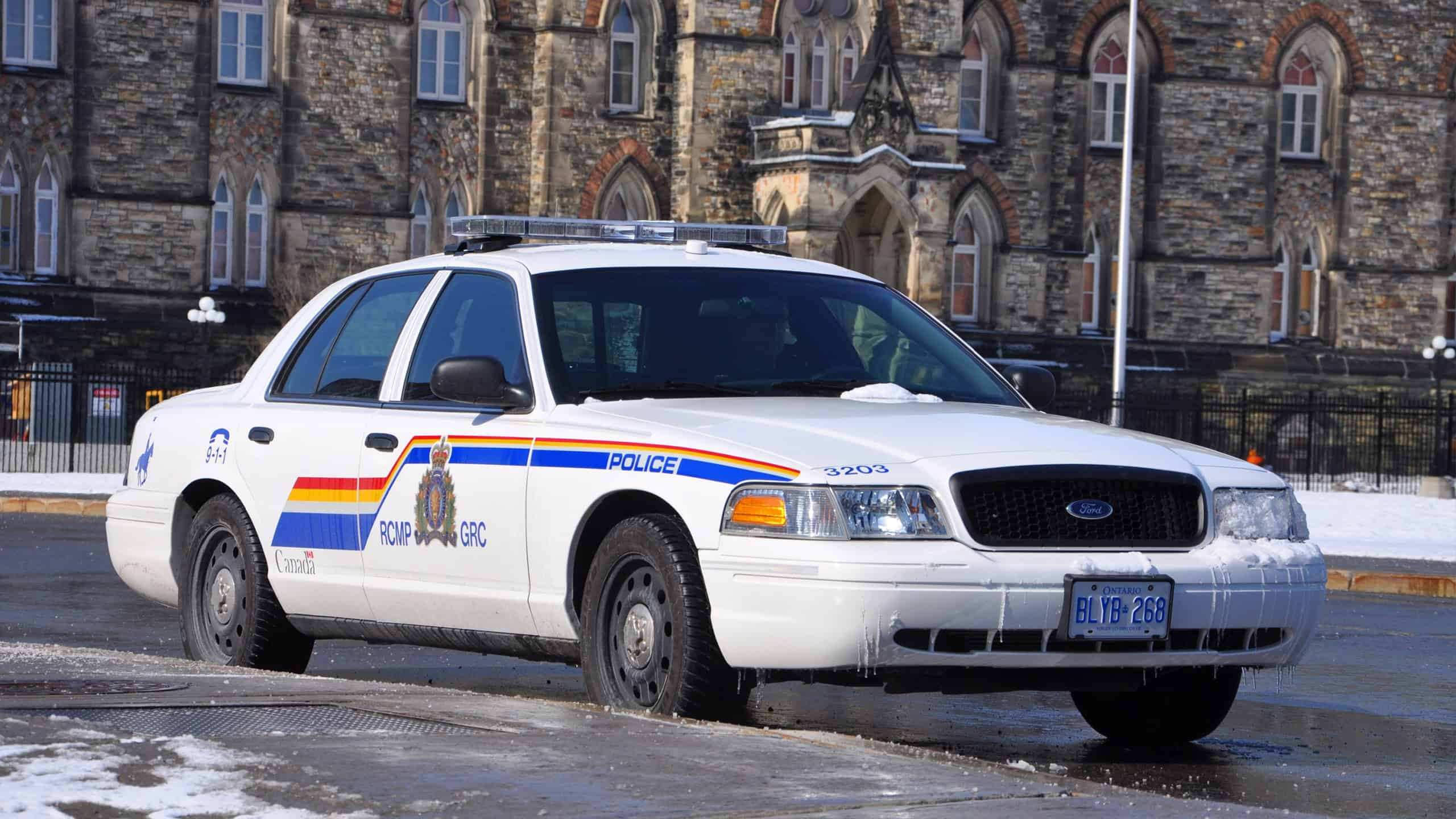 OTTAWA, CANADA - MAR. 10, 2012: RCMP Royal Canadian Mounted Police Ford Crown Victoria Police Car on Parliament Hill in Ottawa, Ontario, Canada.