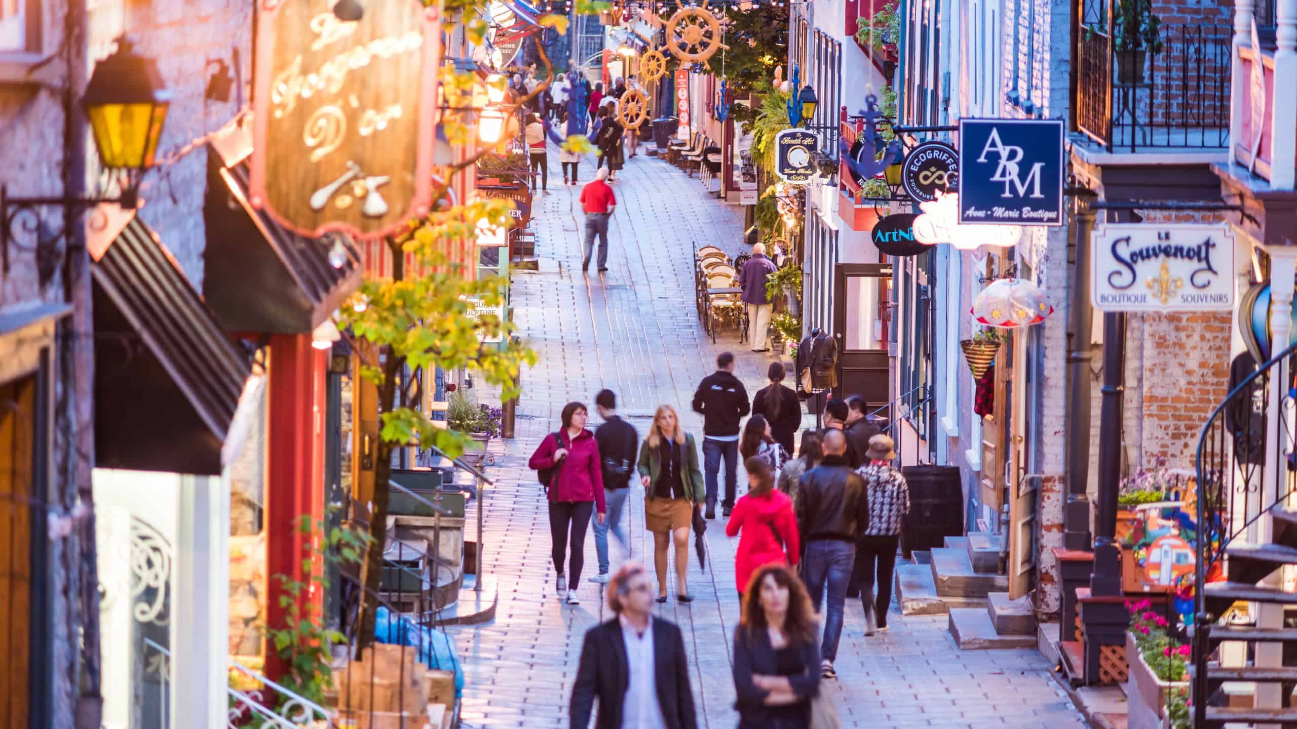 Quebec City, Canada - May 31, 2017: Lower old town street aerial view called Rue du Petit Champlain with people tourists walking