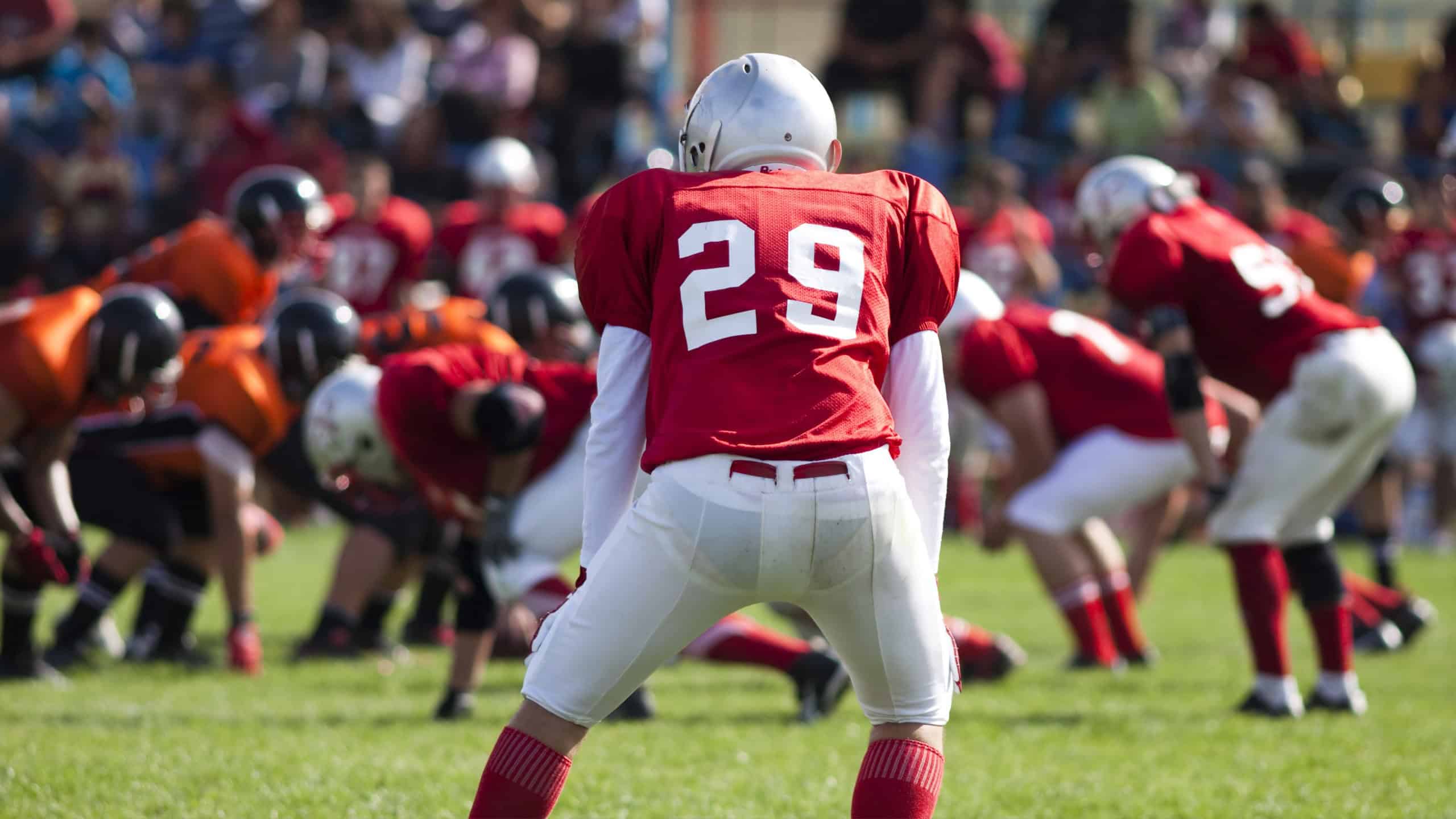 Collage with american football player flies over hands of fans and catching a touchdown pass. Concept of sport, football and fans, support, healthy lifestyle, hobby.
