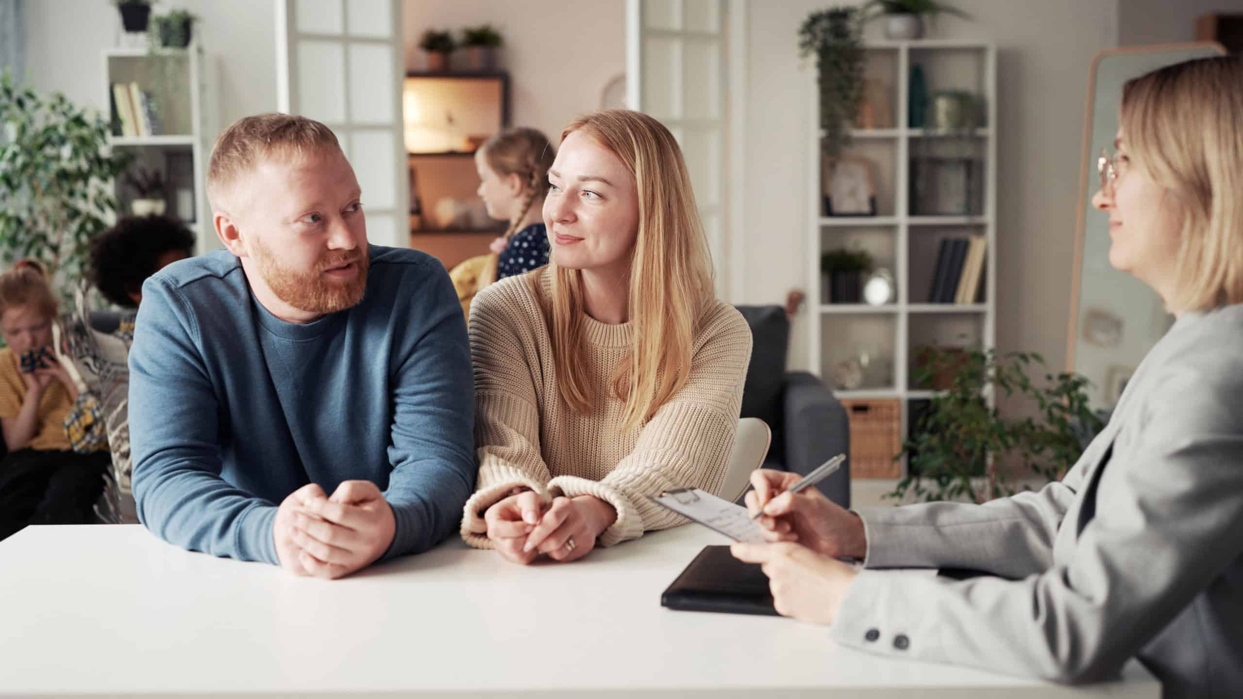 Couple talking to social worker about adoption