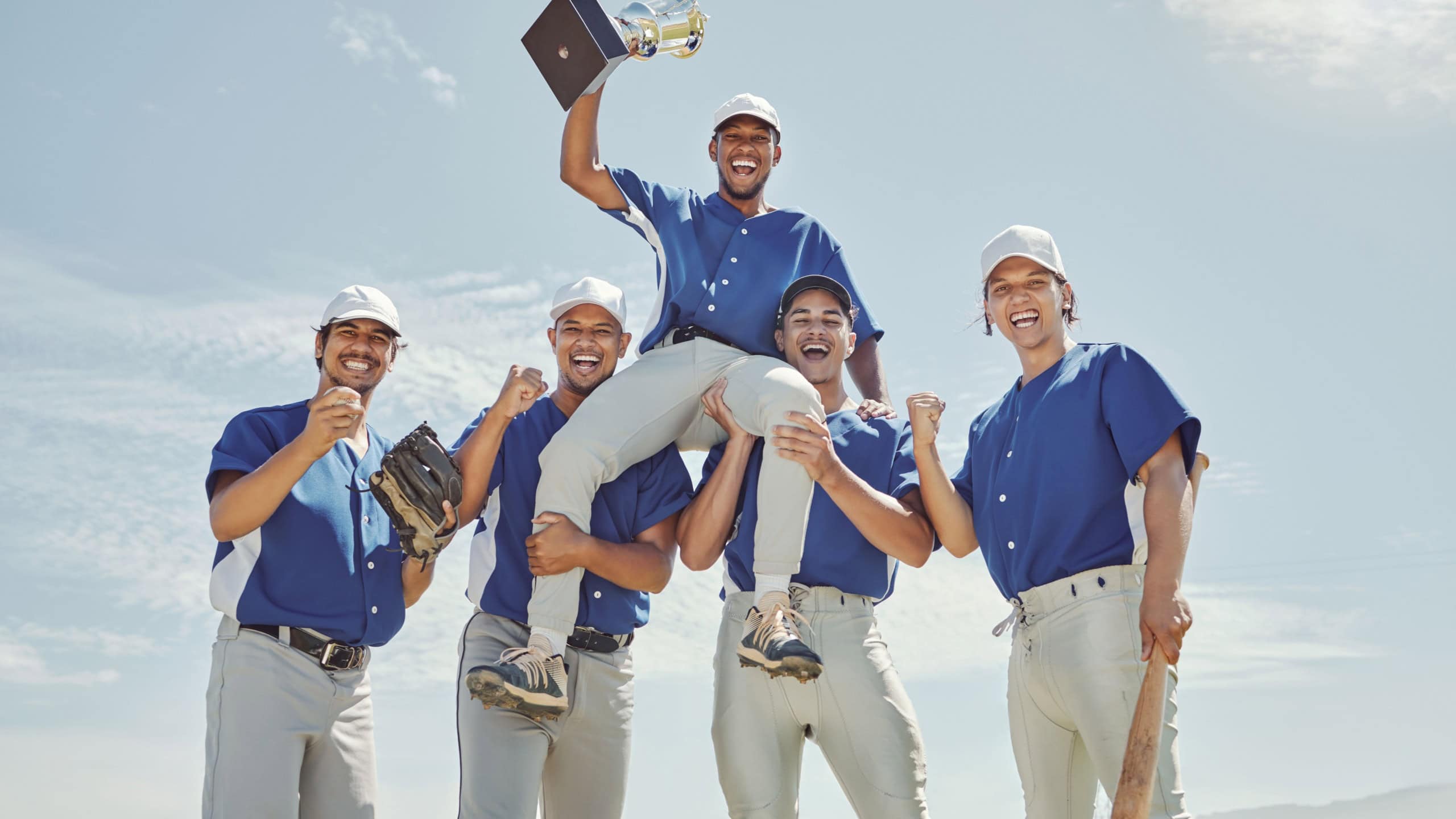 Baseball team, winner men or trophy success in fitness game, workout match or competition exercise. Portrait, smile or happy baseball players winning award in softball, field sports or stadium event