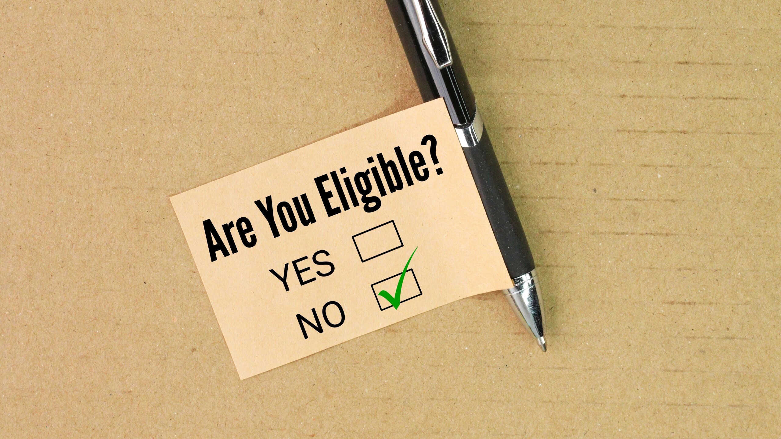 Pen and paper with the question Are you eligible? the answer is no. concept is not selected