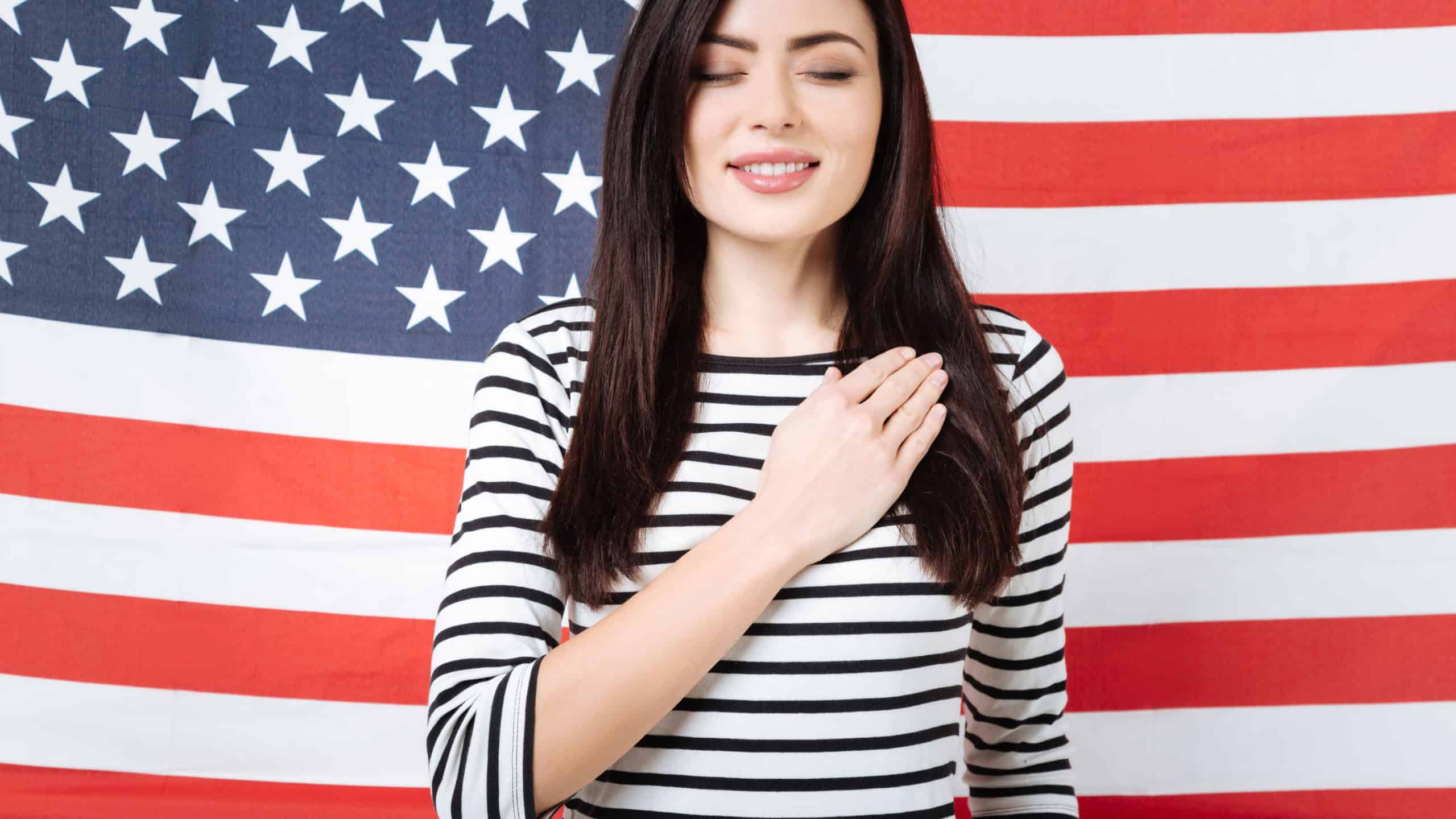 Charming woman taking an oath in the studio