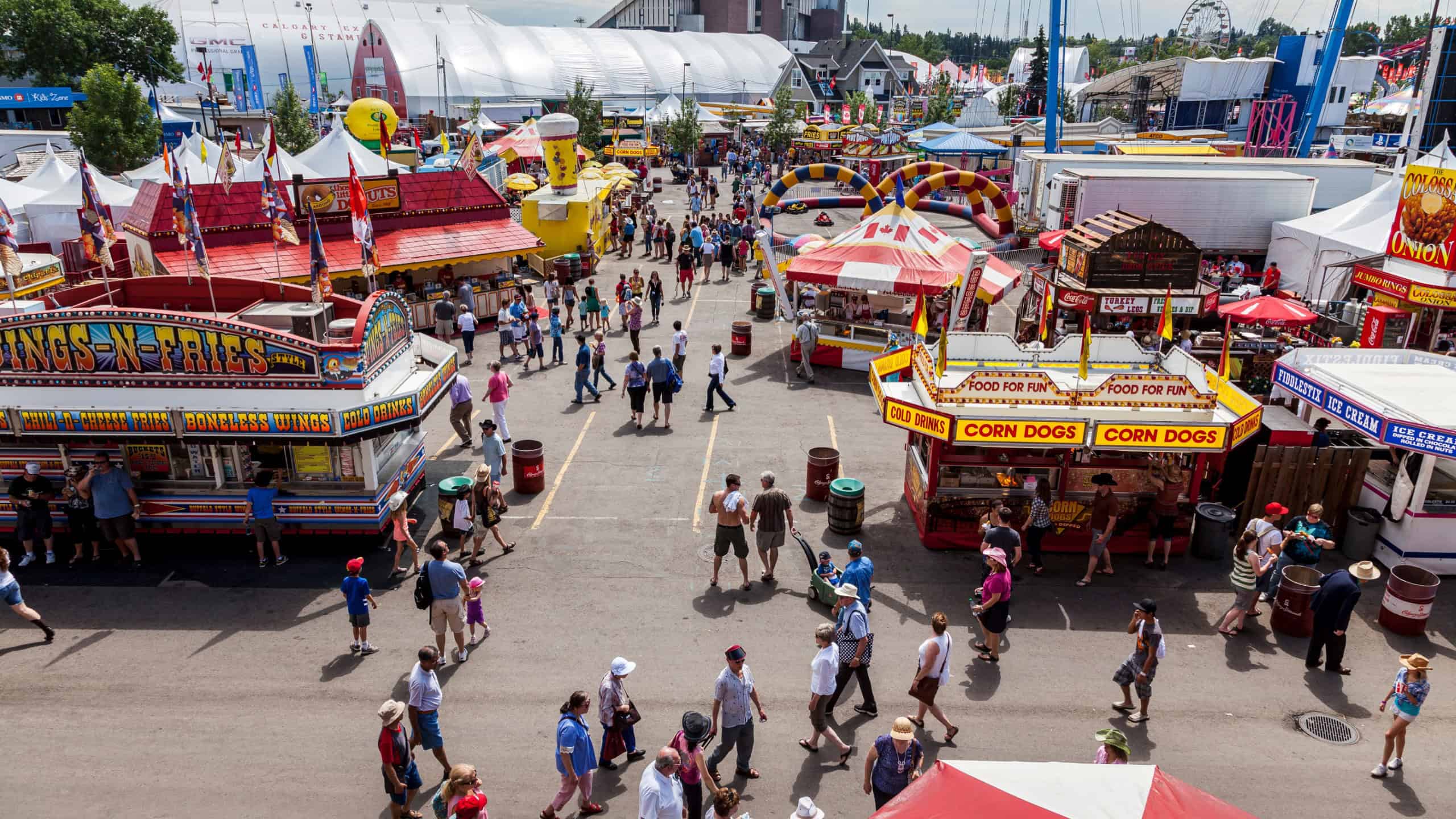 Canada, July 11, 2012: View of people at the fair grounds of the Calgary Stampede event. Tourists and visitors enjoying and entertaining themselves.