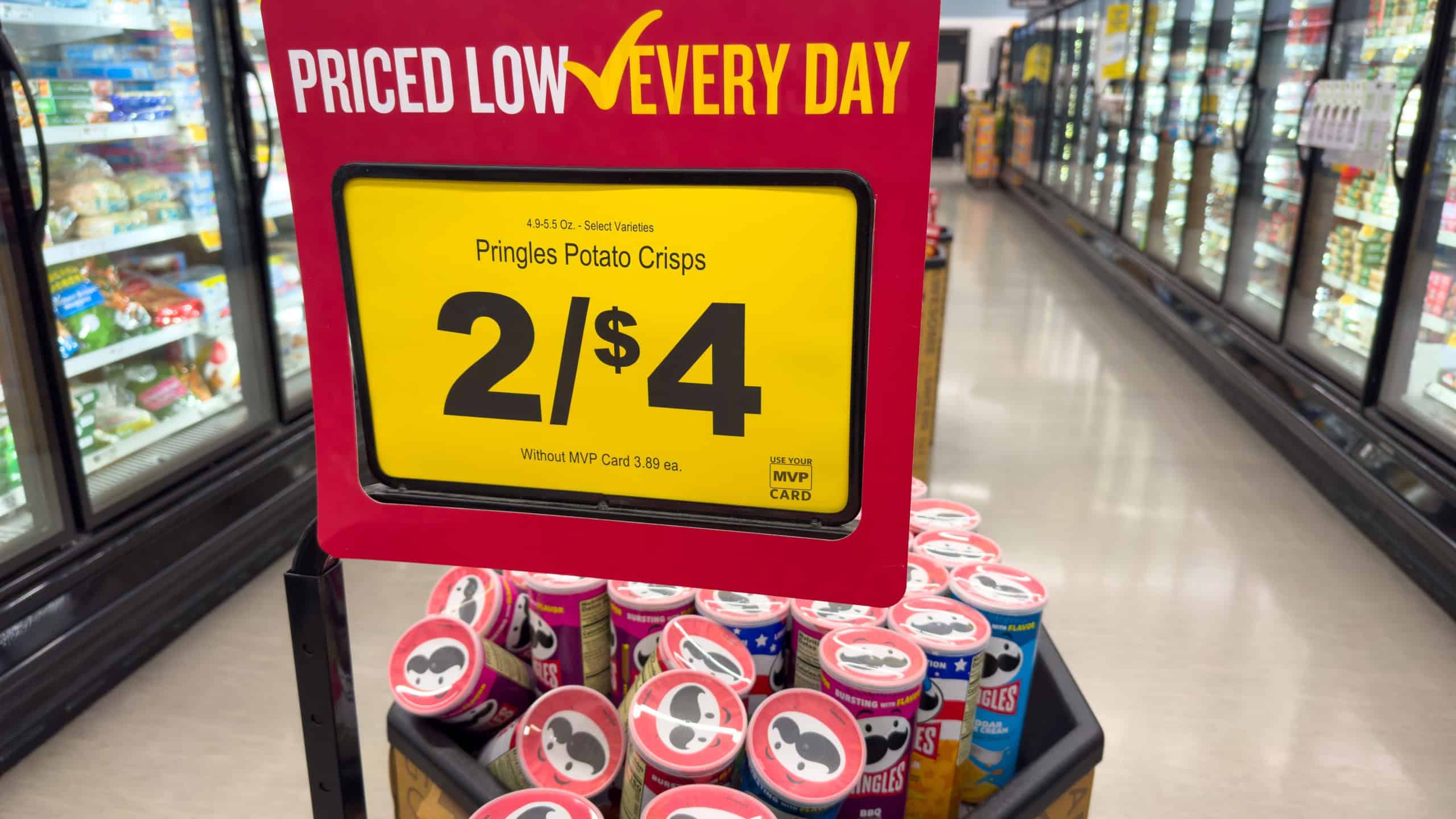 Myrtle Beach, SC - June 10, 2025: Pringles Potato Crisps Sale Display in Grocery Aisle.