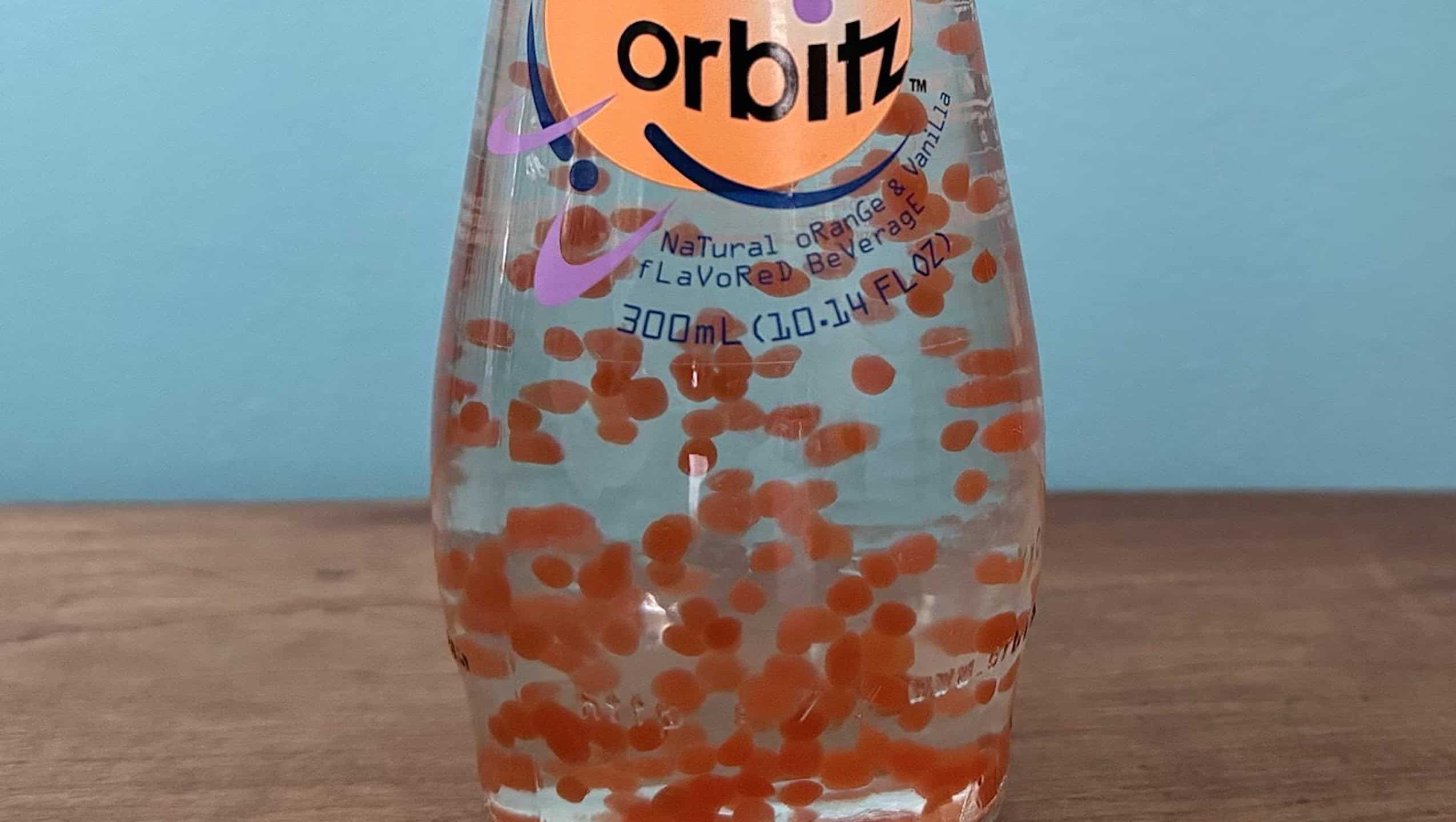 A bottle of vanilla orange flavored Orbitz soft drink
