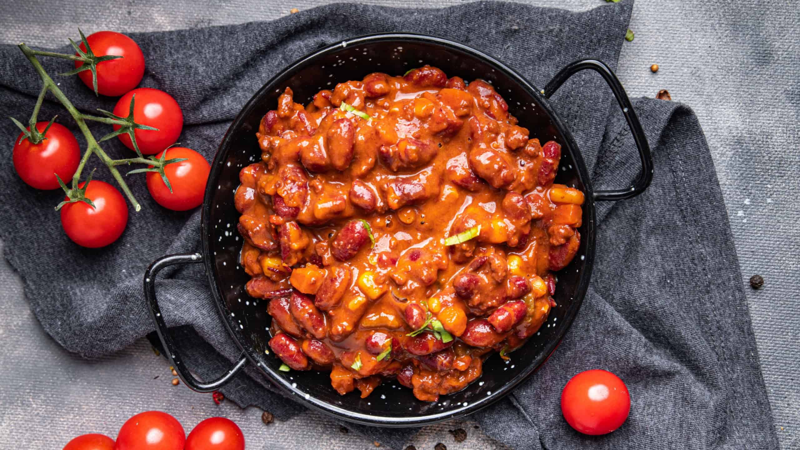 chili con carne beans, corn, meat, tomato healthy meal food snack on the table copy space food background rustic top view