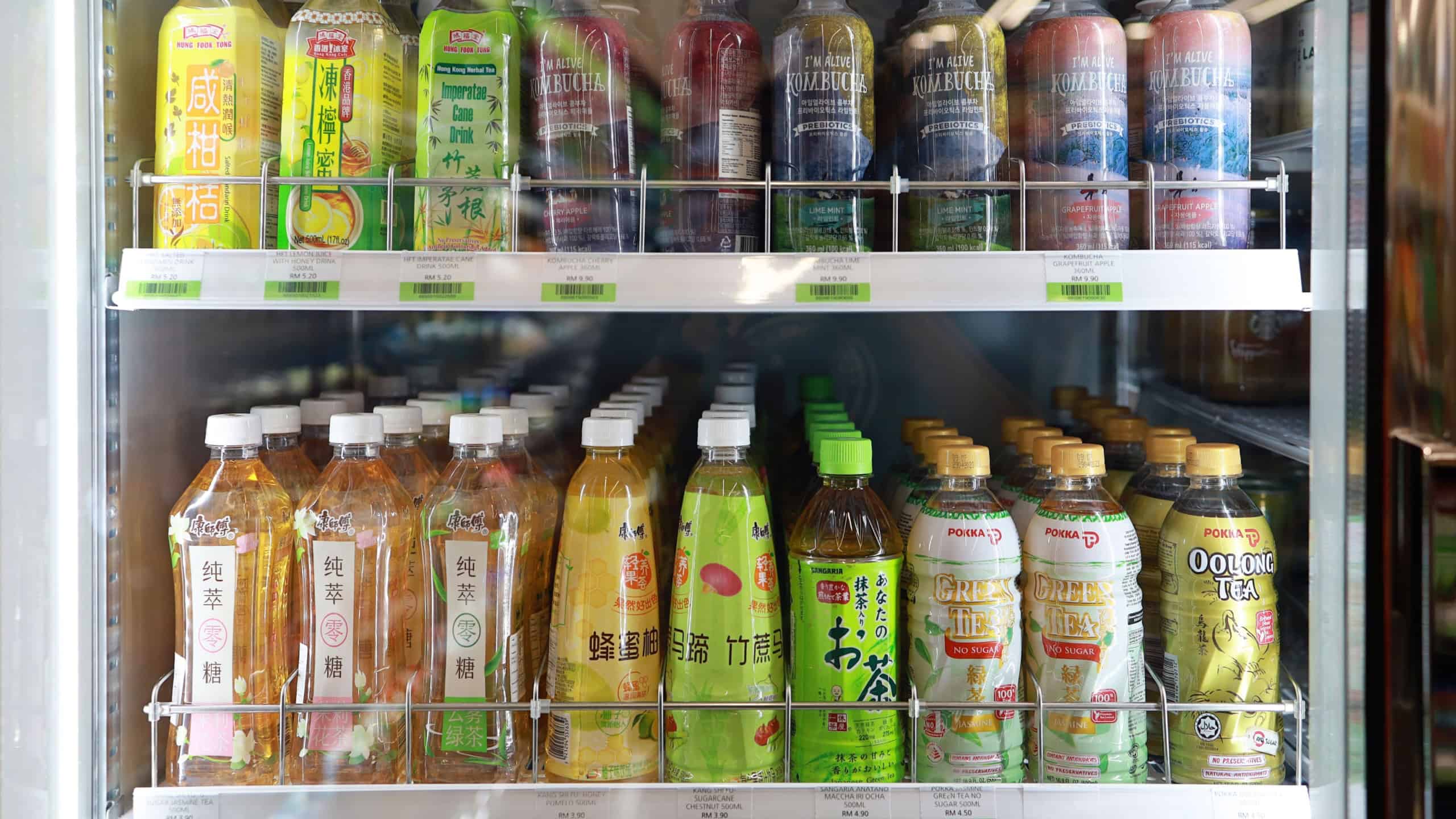 PENANG, MALAYSIA - 16 SEP 2022: Huge fridge with various choice of tea beverages in CU Convenience Store. CU is a South Korean convenience store chain that is operated and owned by BGF Retail.