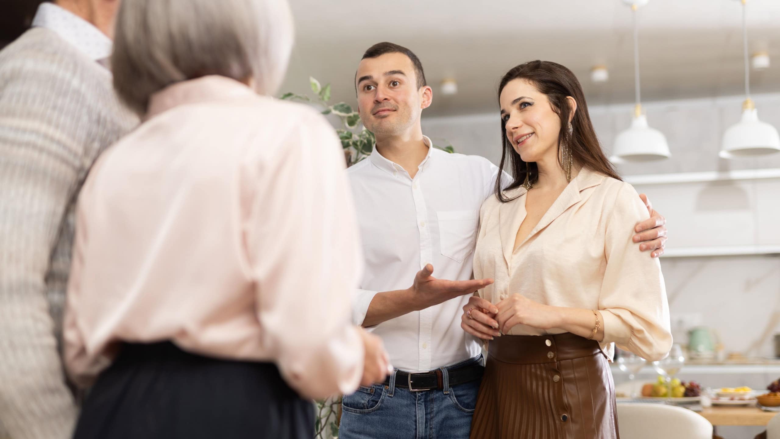 Middle-aged son introduces his girlfriend to elderly parents. Upset parents look disapprovingly at their son and his chosen one.