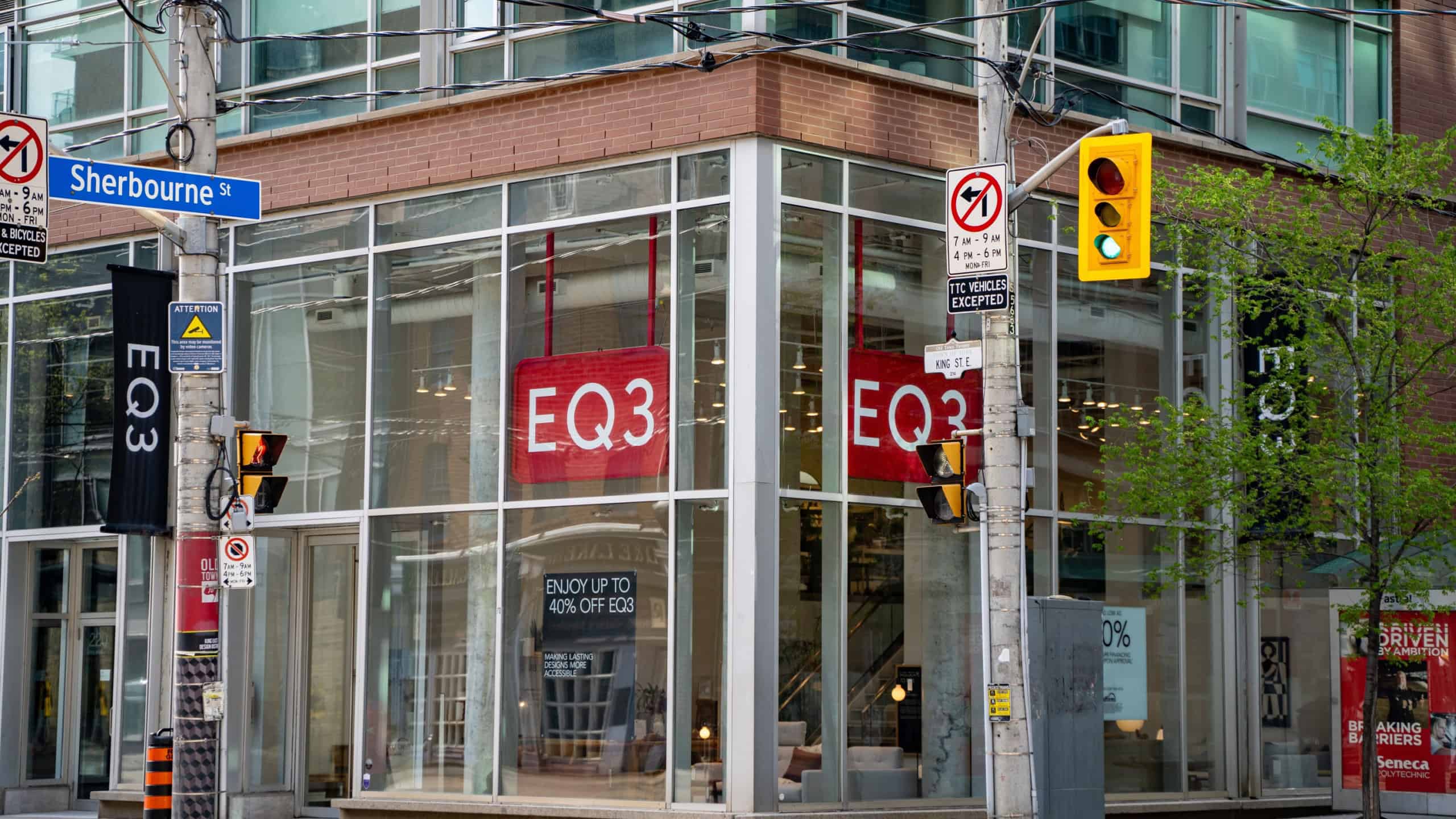 Logo sign of EQ3 furniture store. Toronto, Canada - May 12, 2024.