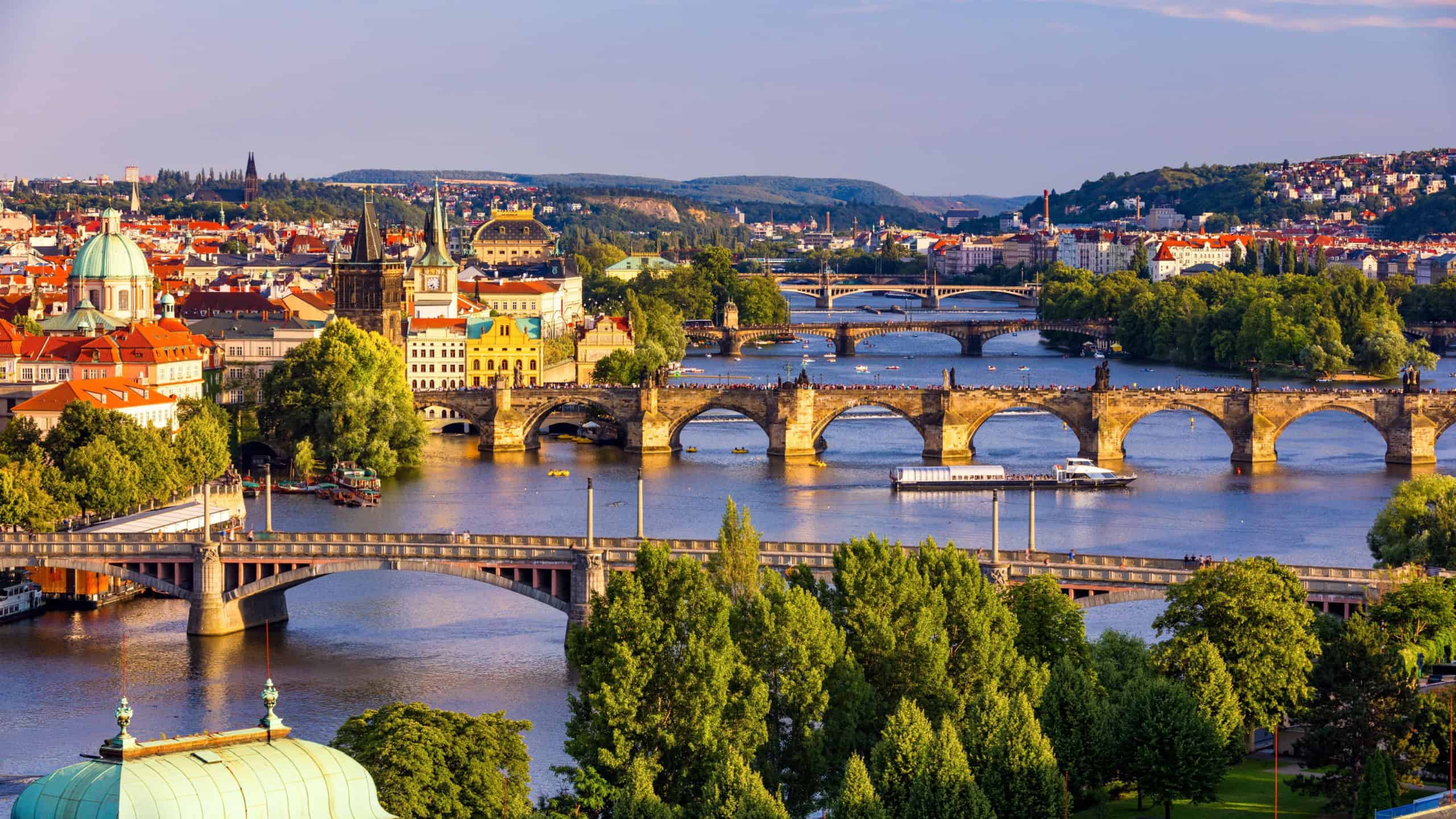 Scenic view of the Old Town pier architecture and Charles Bridge over Vltava river in Prague, Czech Republic. Prague iconic Charles Bridge (Karluv Most) and Old Town Bridge Tower at sunset, Czechia.