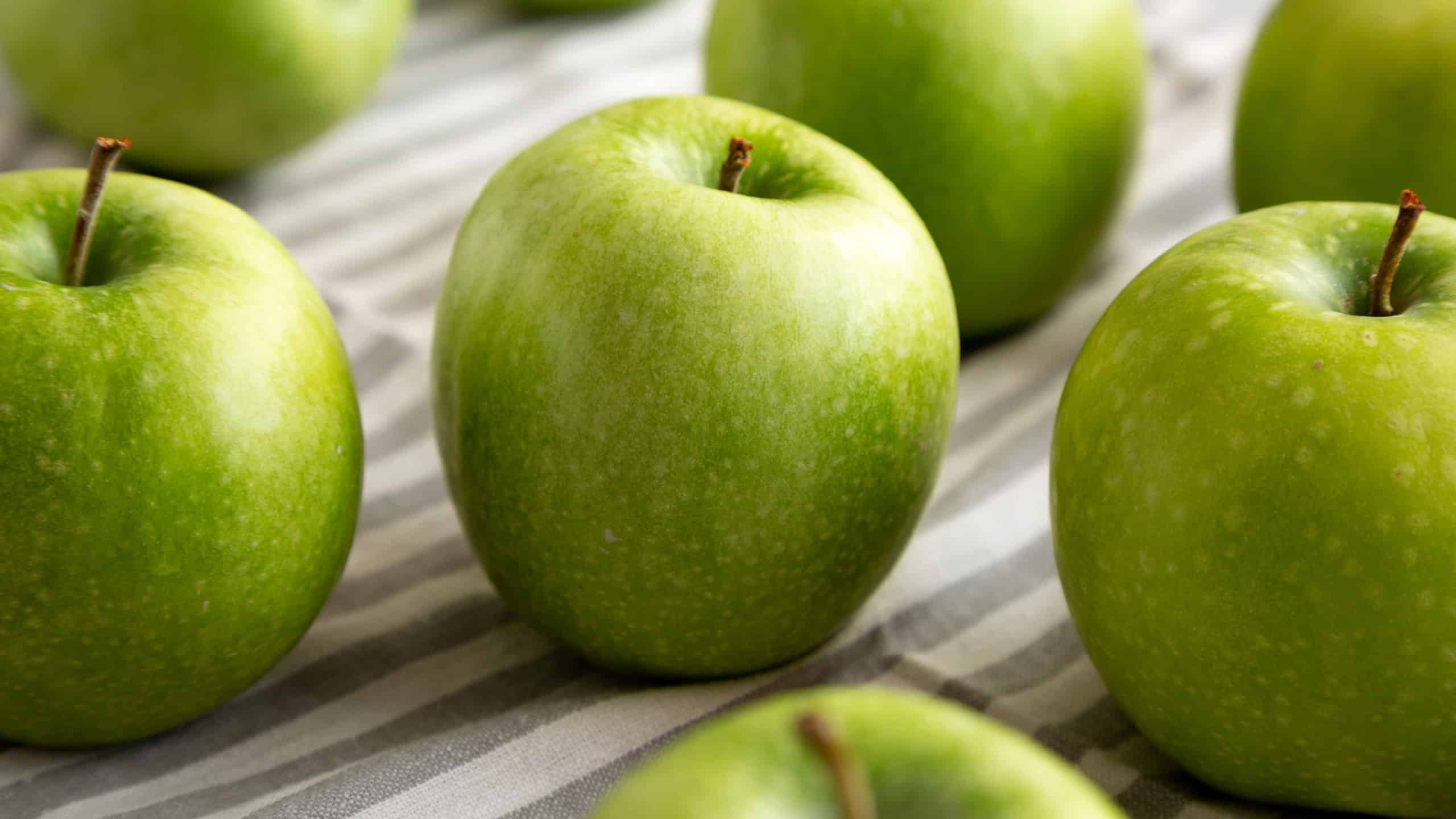 Organic Green Granny Smith Apples, low angle view. Close-up.