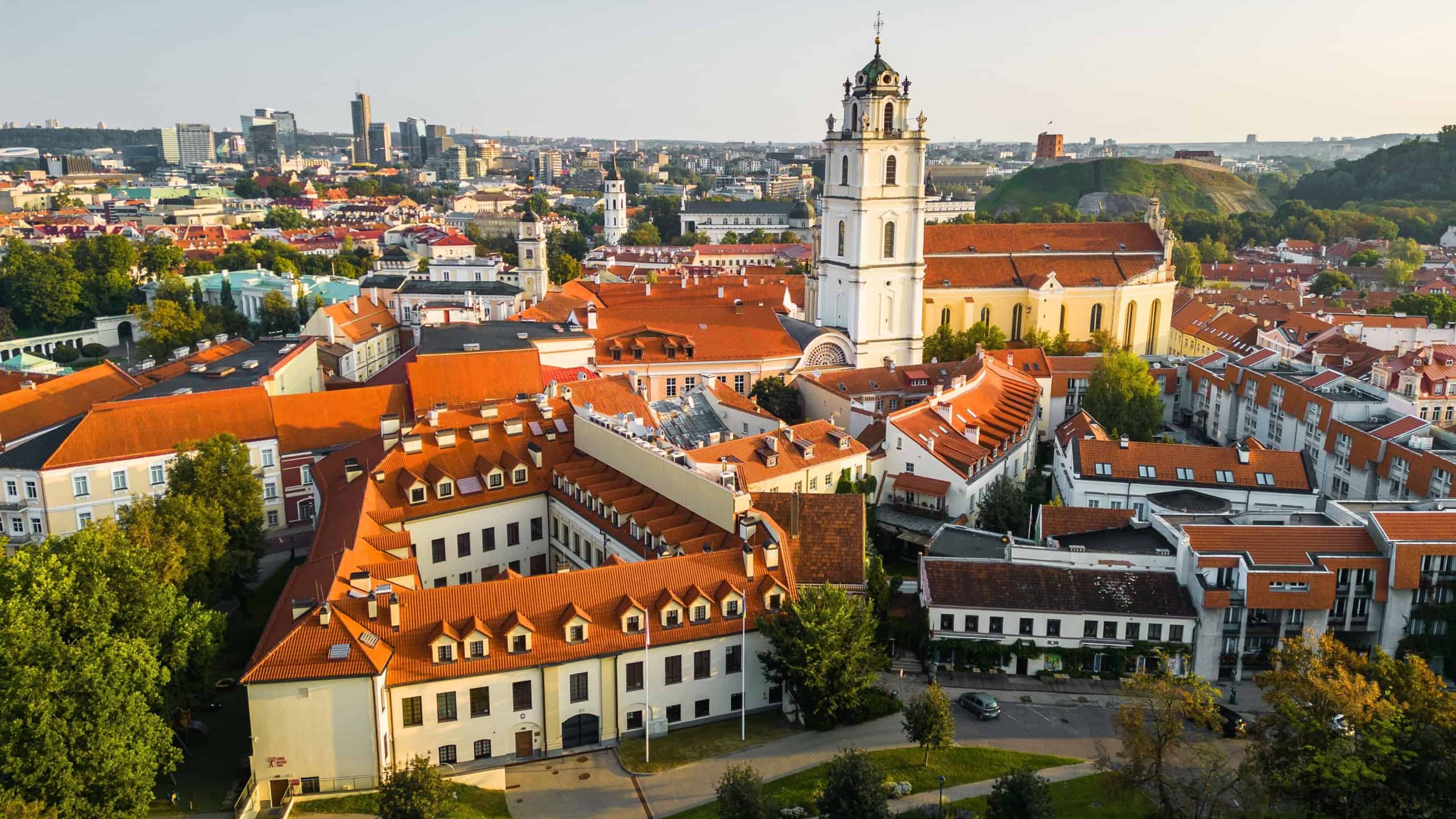 Aerial View of Vilnius Old Town With The University Bell Tower Above the Horizon