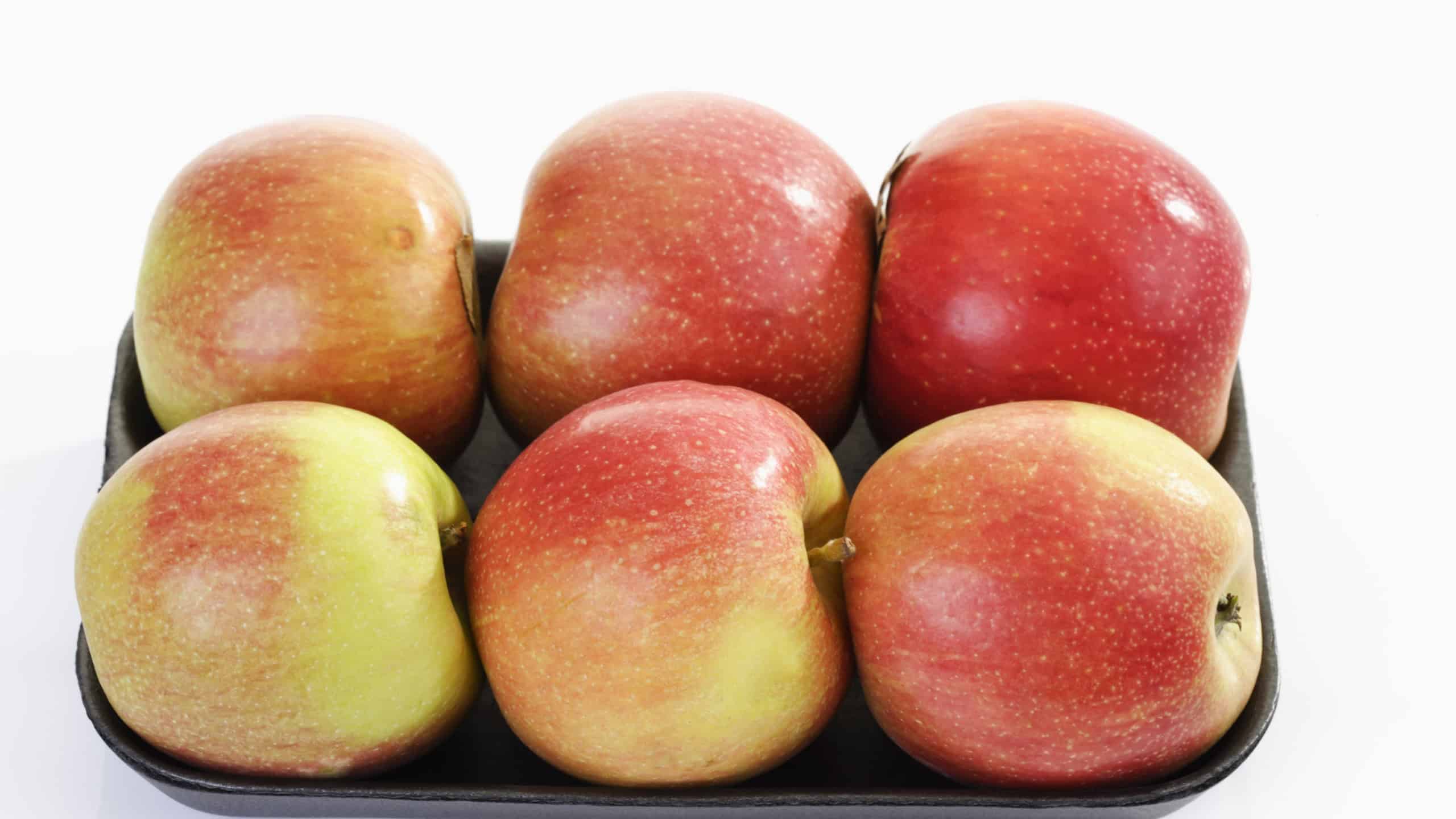 Braeburn apples in plastic bowl