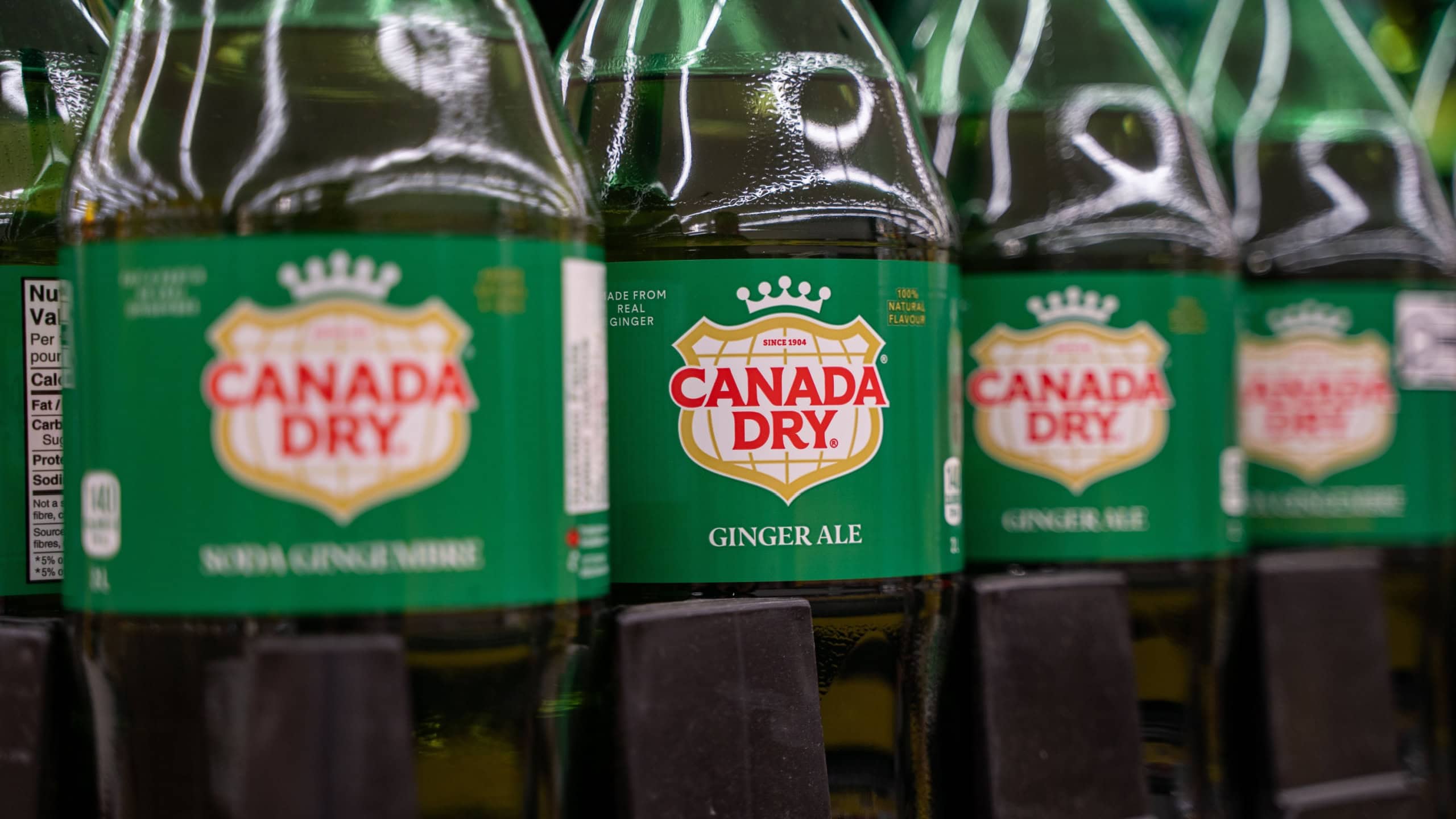 Close up of Canada Dry ginger ale bottles on store shelf. Toronto, Canada - October 3, 2025.
