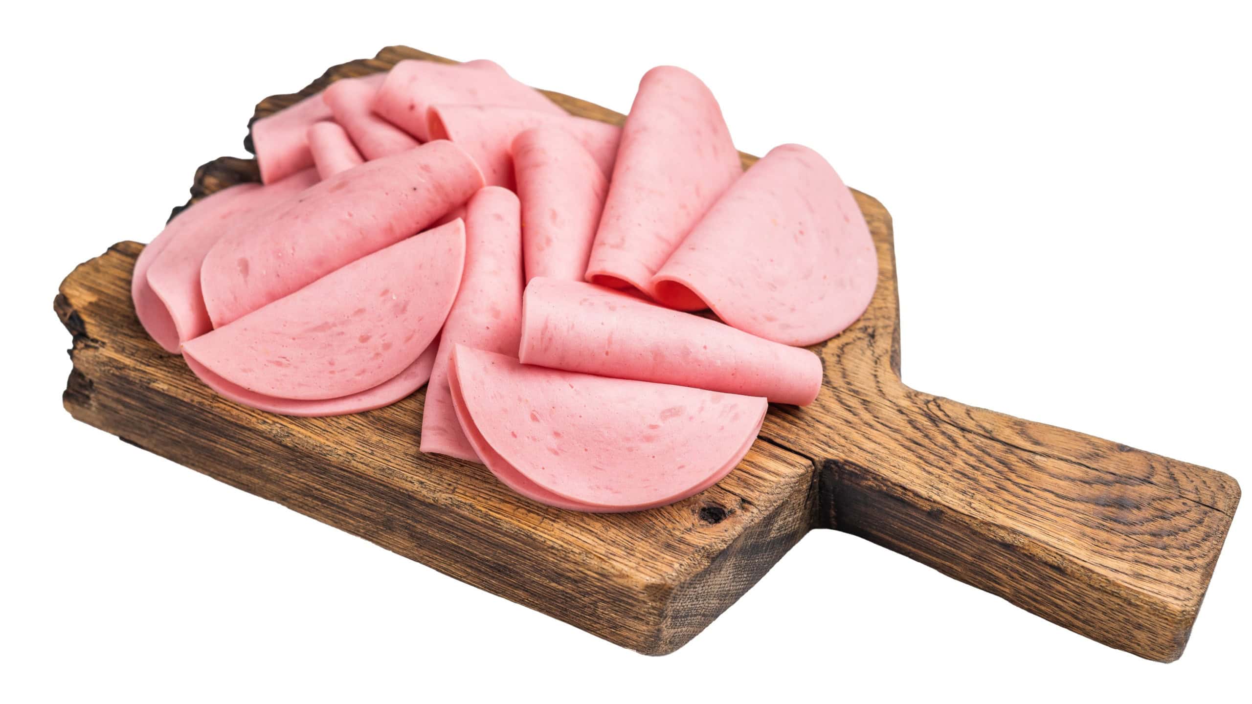 Raw, processed luncheon meat (salami ham) slices piled high on a rustic wood board, perfect for sandwiches or a quick snack