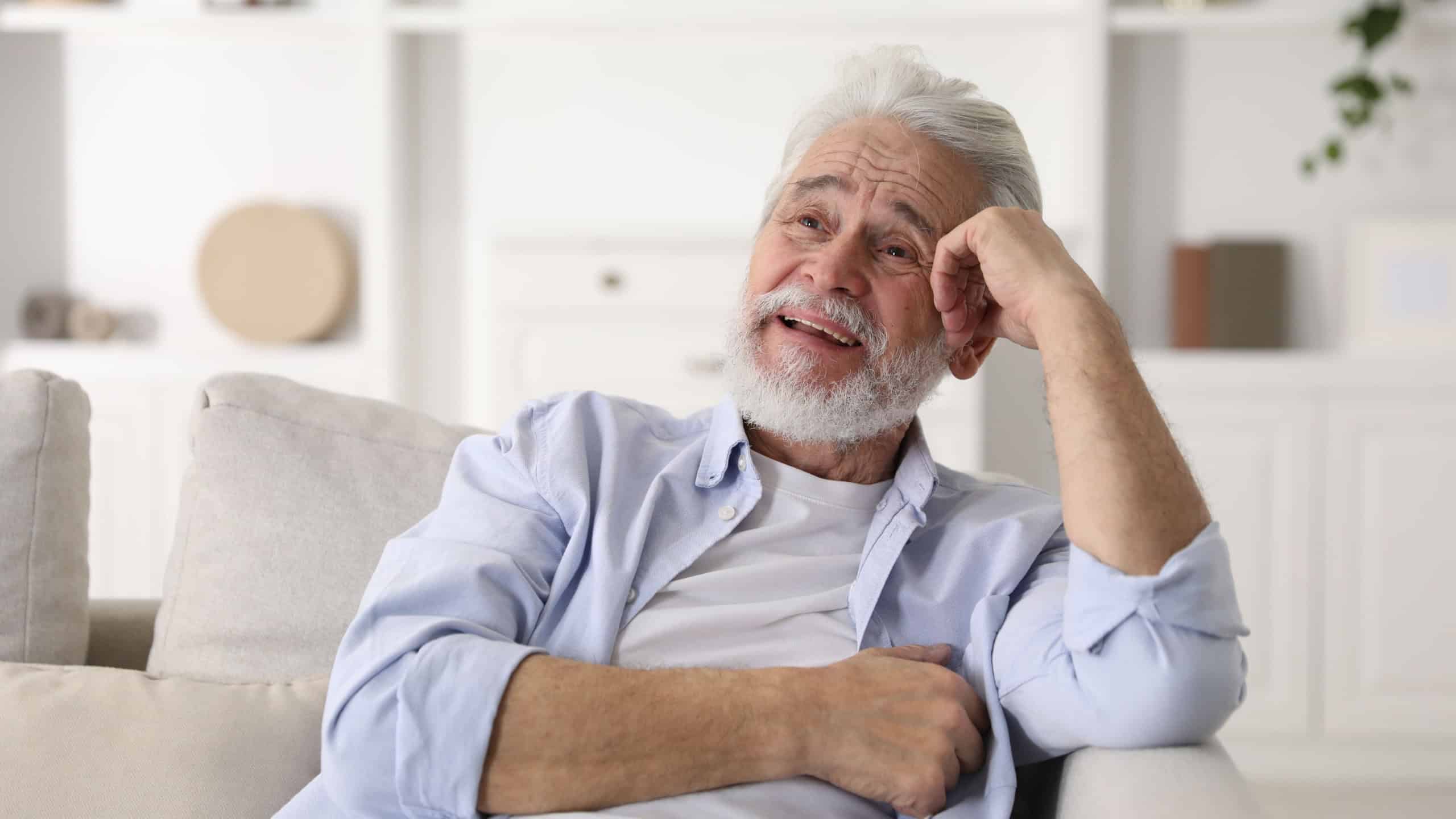 Amnesia. Senior man remembering something at home