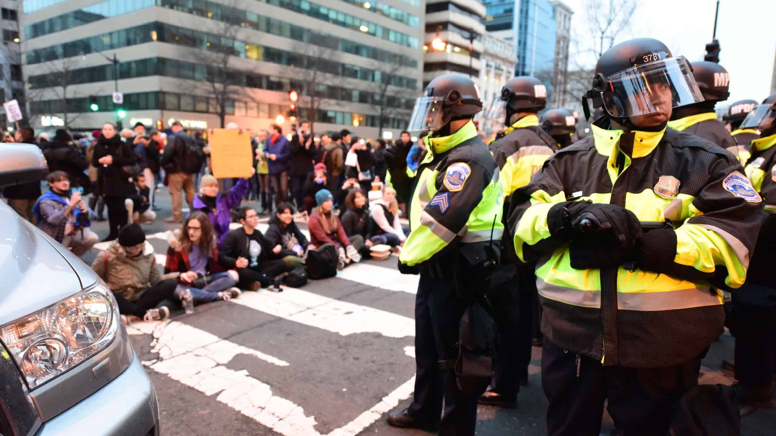 WASHINGTON DC - JANUARY 20 2017: Protests filled Washington DC during Donald Trump's Inauguration Day. Protestors face off with DCPD