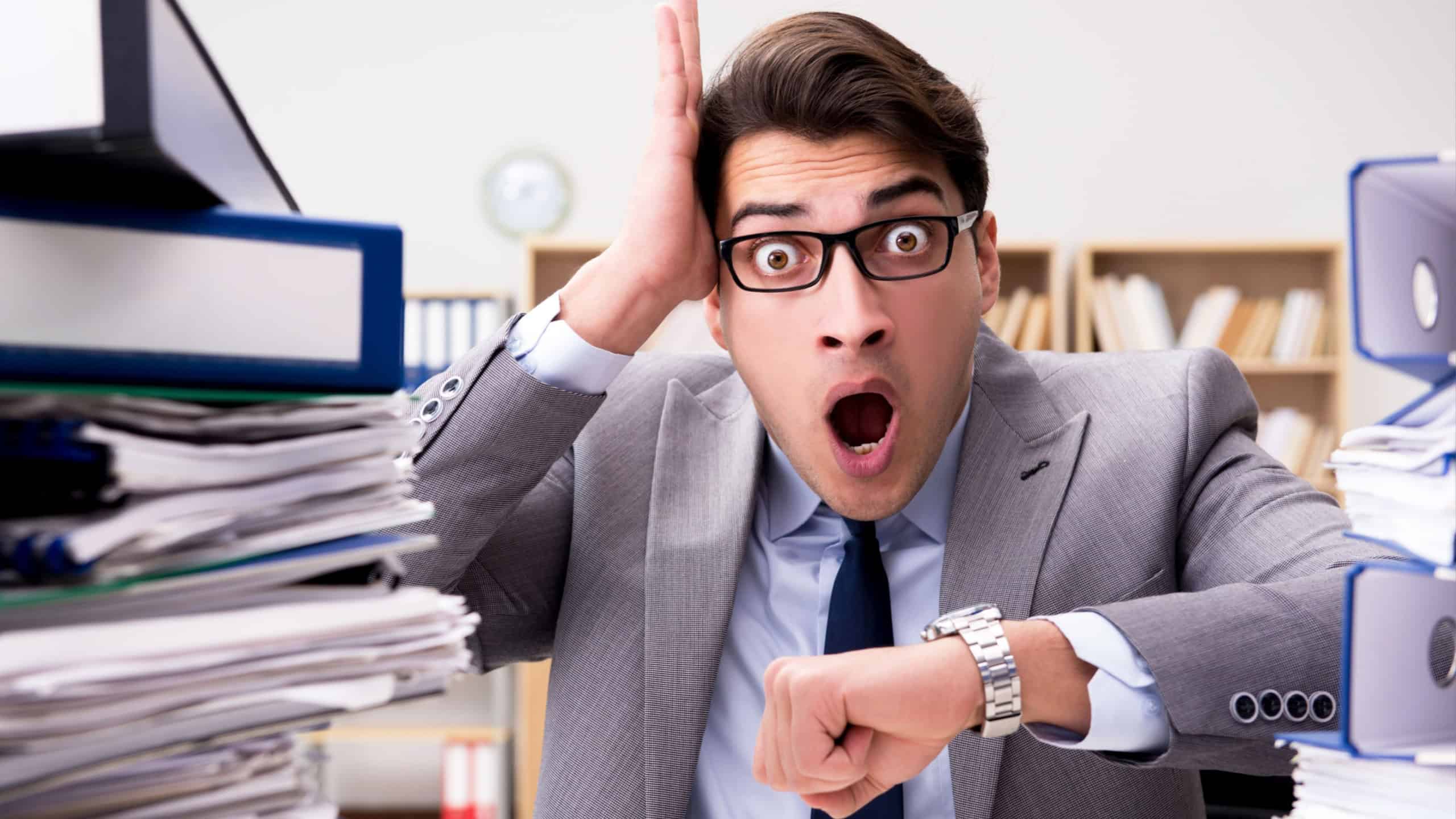 Busy businessman under stress due to excessive work