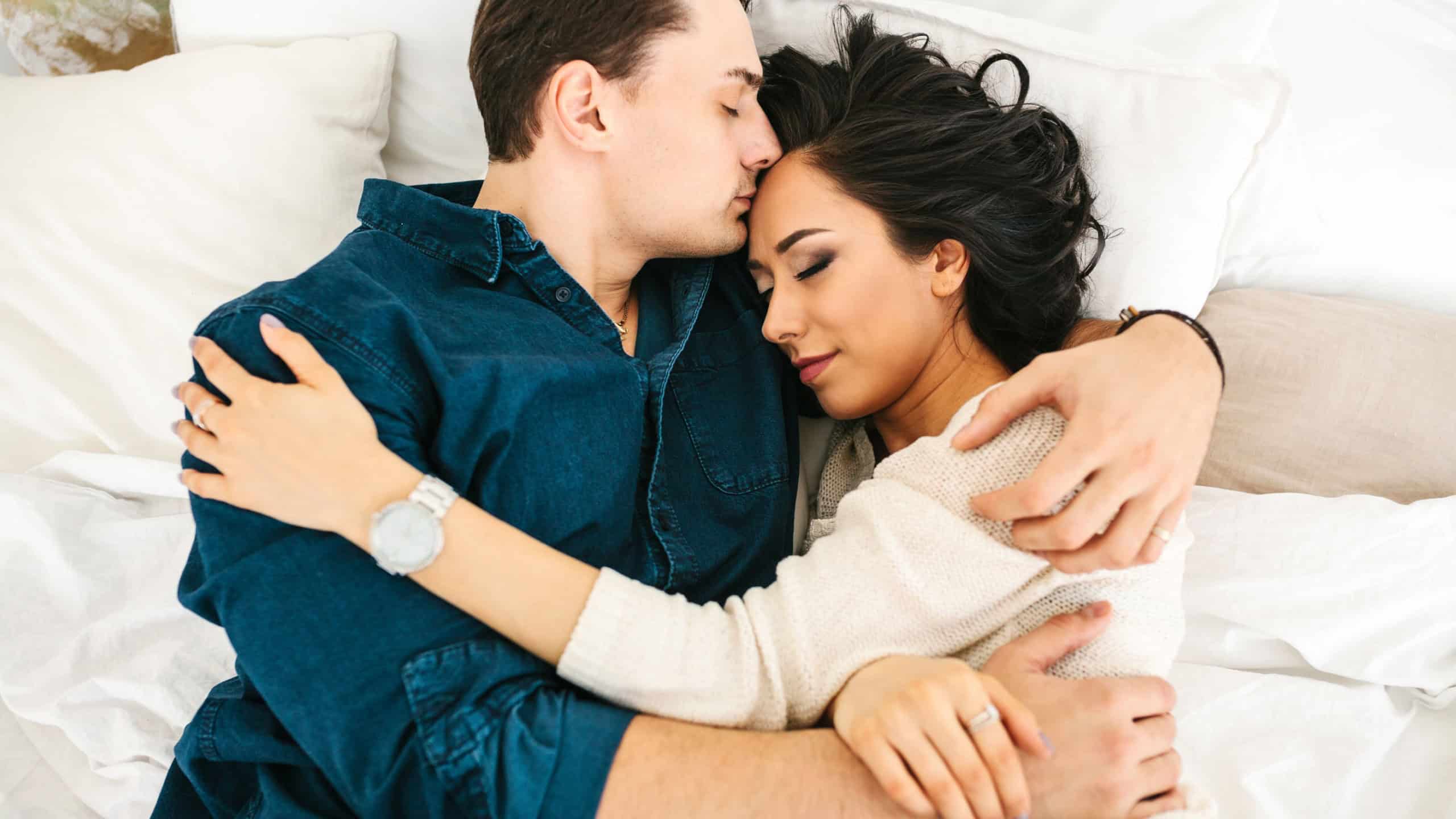 Young beautiful couple hugging and talking. Deep feelings, love, affection. Close trusting relationship between a man and a woman.