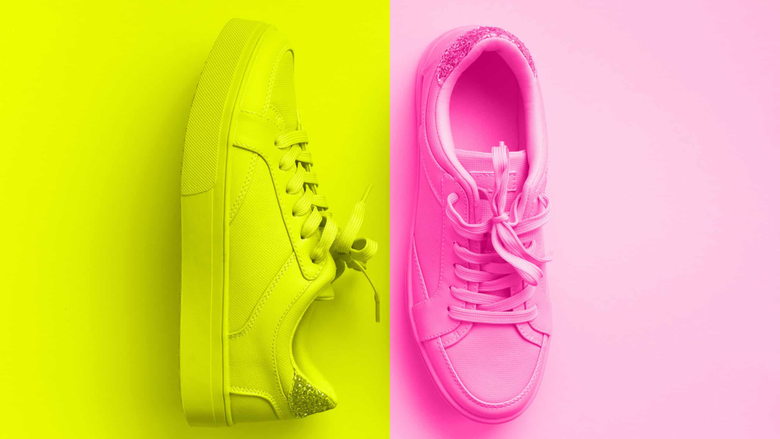 Woman fashion pink shoes on trendy neon pink and yellow colors background with copy space. Top view. Flat lay. Fitness, sport concept. Nude female sneakers.