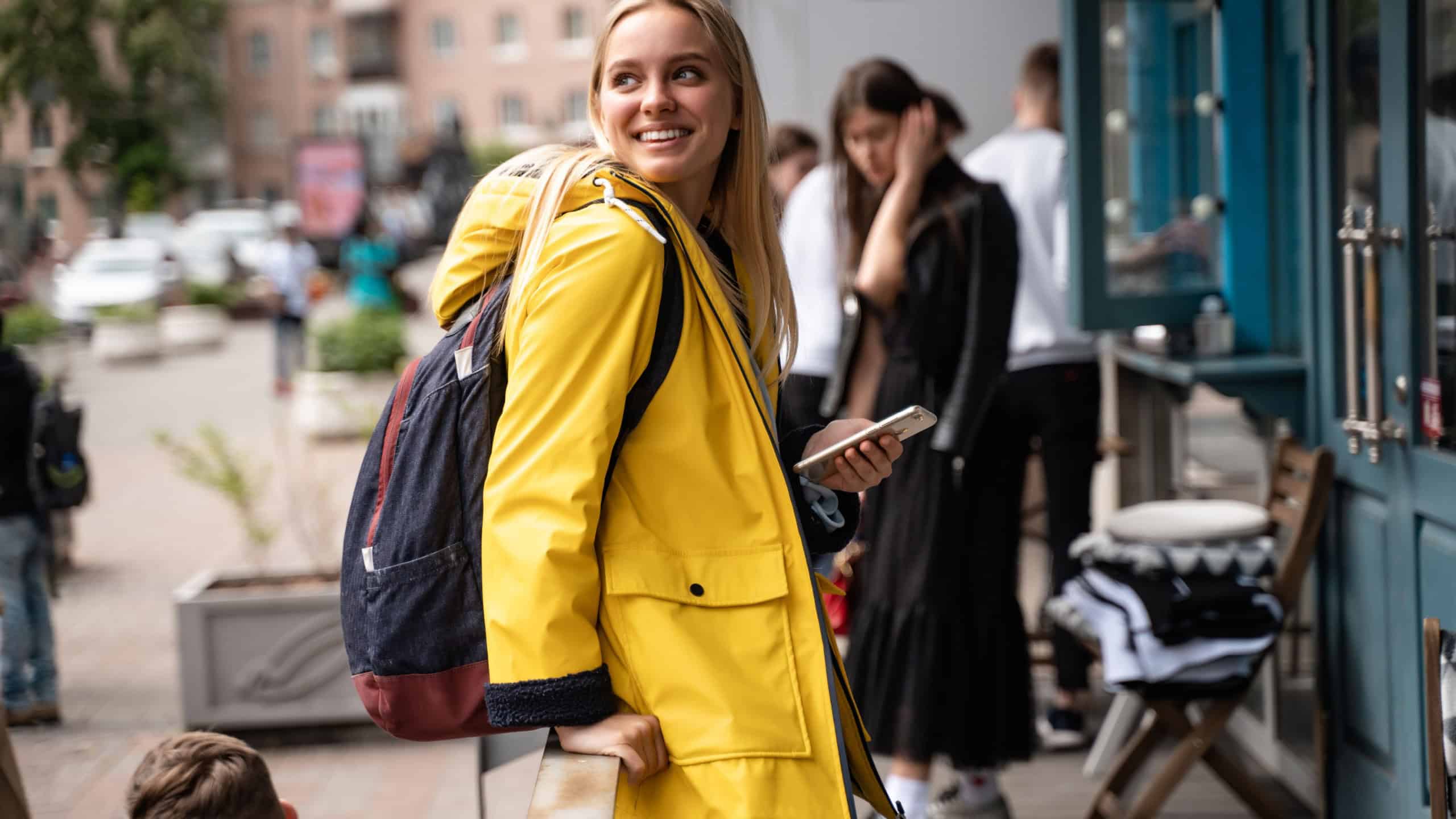 Woman walking and using a smartphone in the street