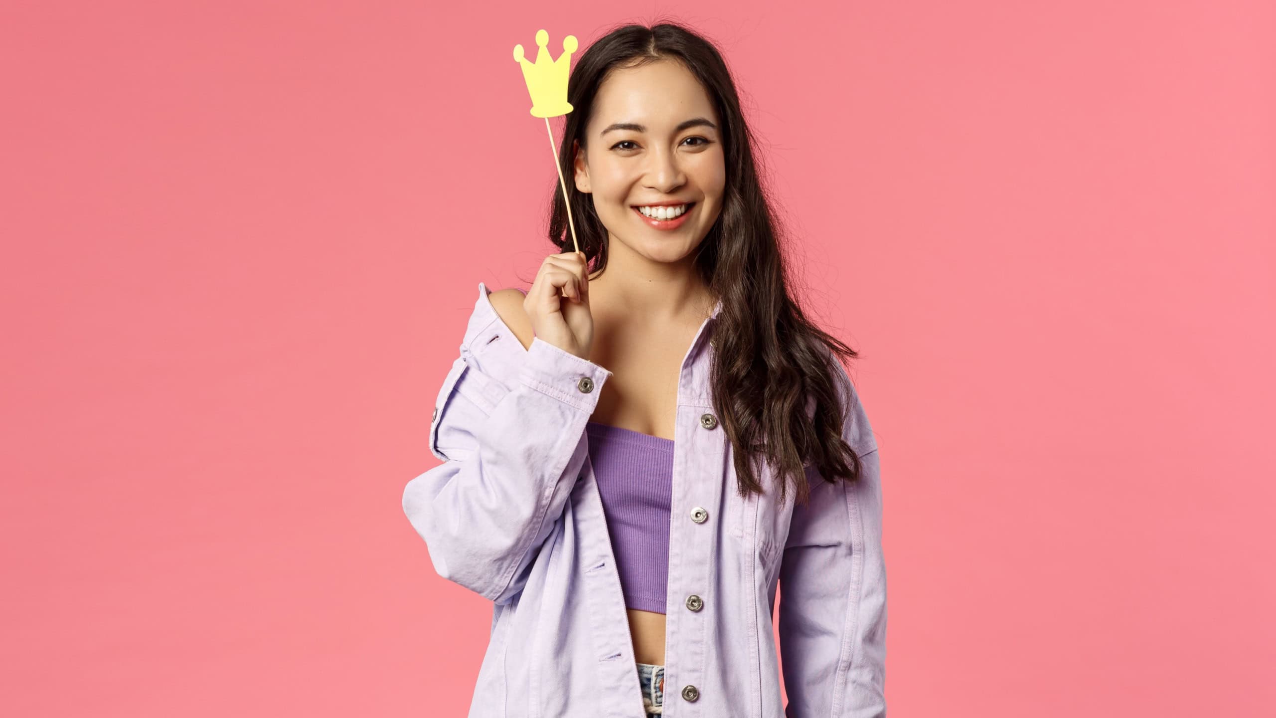 Holidays, lifestyle and people concept. Portrait of charismatic good-looking, stylish asian girl having fun, holding crown stick near head, feeling like little princess, smiling camera
