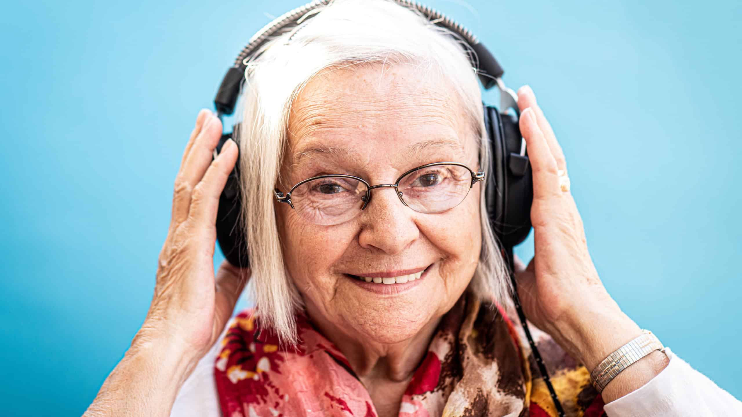 Happy Senior Woman Loves Music and Fun