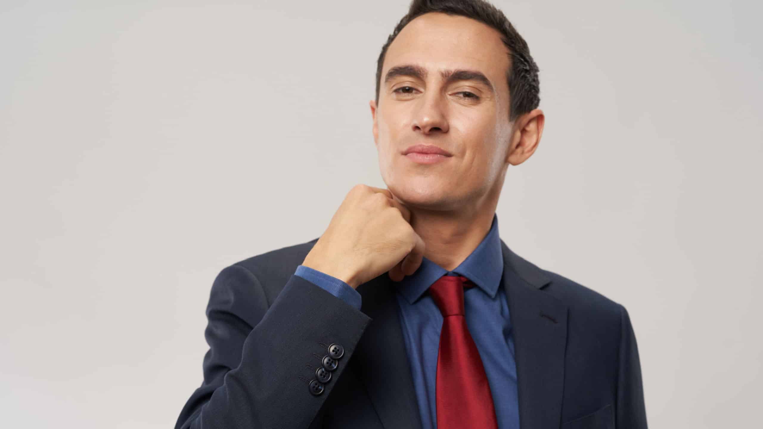 man classic suit red tie confident look