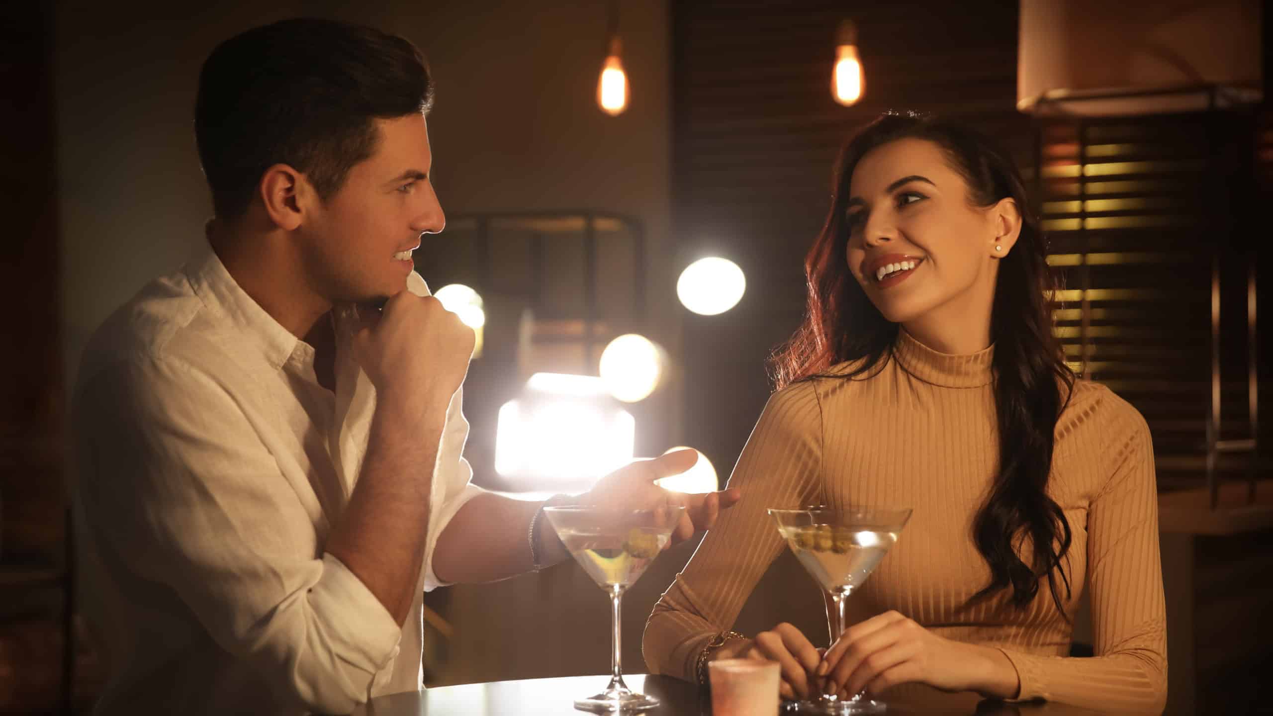 Man and woman flirting with each other in bar