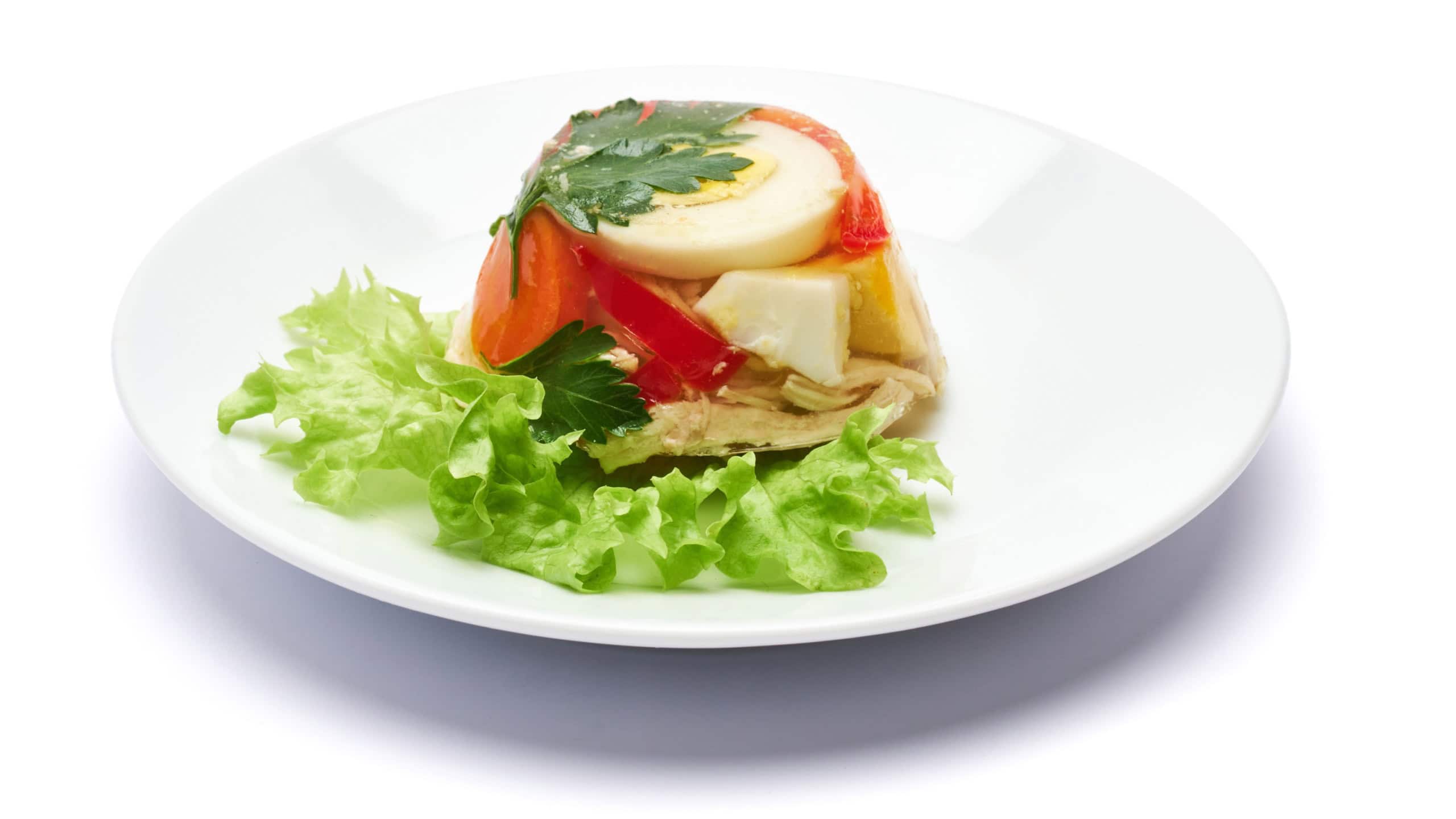Delicious chicken aspic on a plate isolated on white background