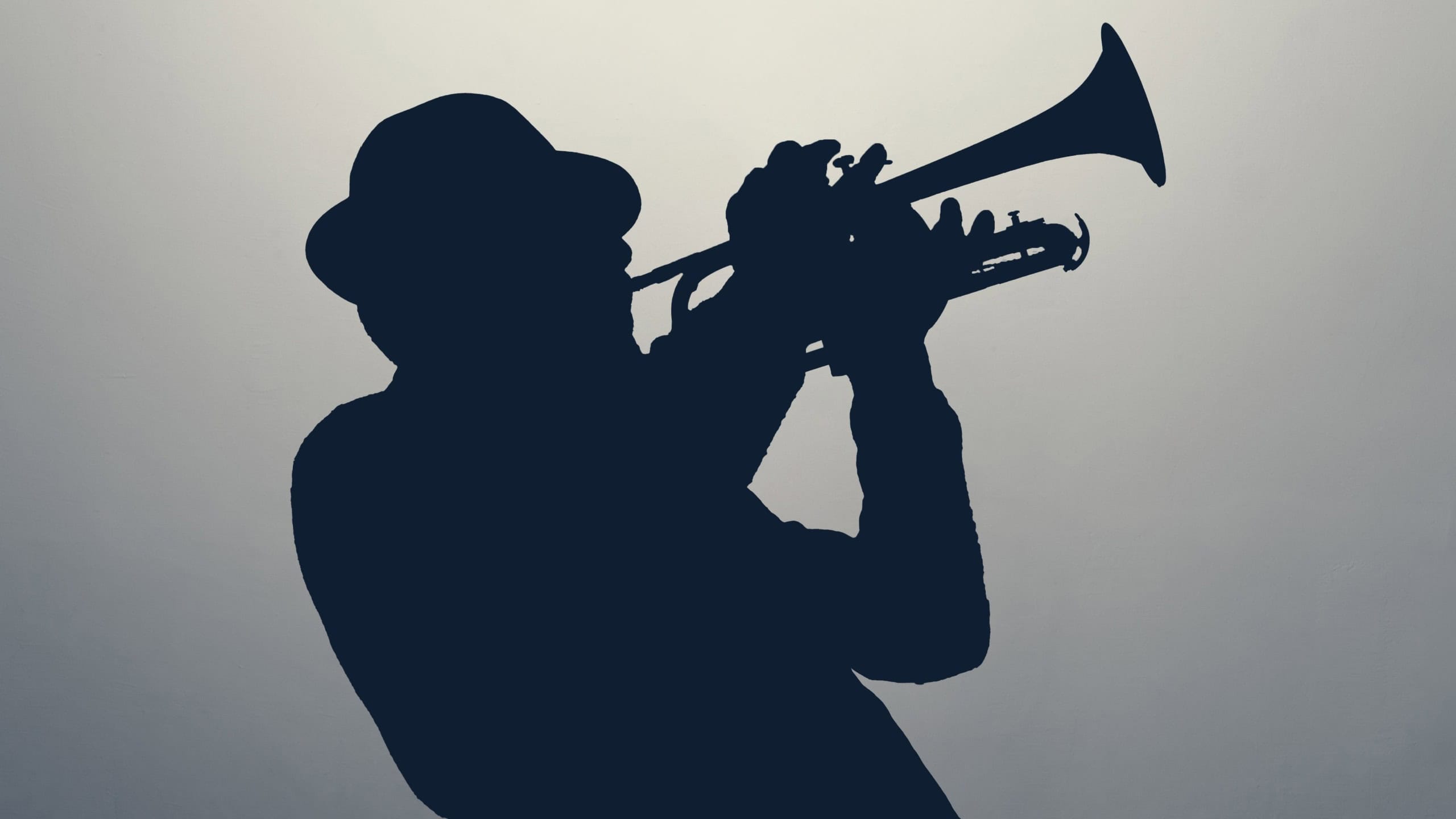 Silhouette of a jazz man playing trumpet