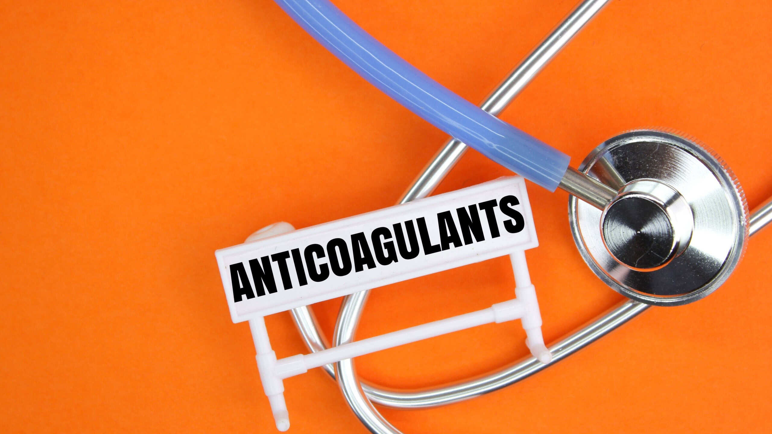 stethoscope with the word ANTICOAGULANTS. medical concept. A substance that is used to prevent and treat blood clots in blood vessels and the heart