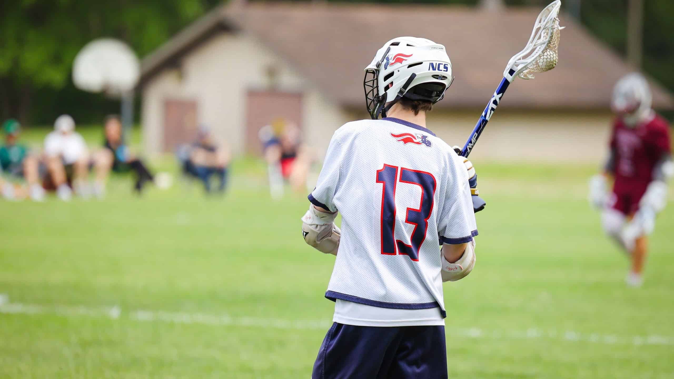 NEWARK, US - Aug 05, 2022: A lacrosse player in the green field in action