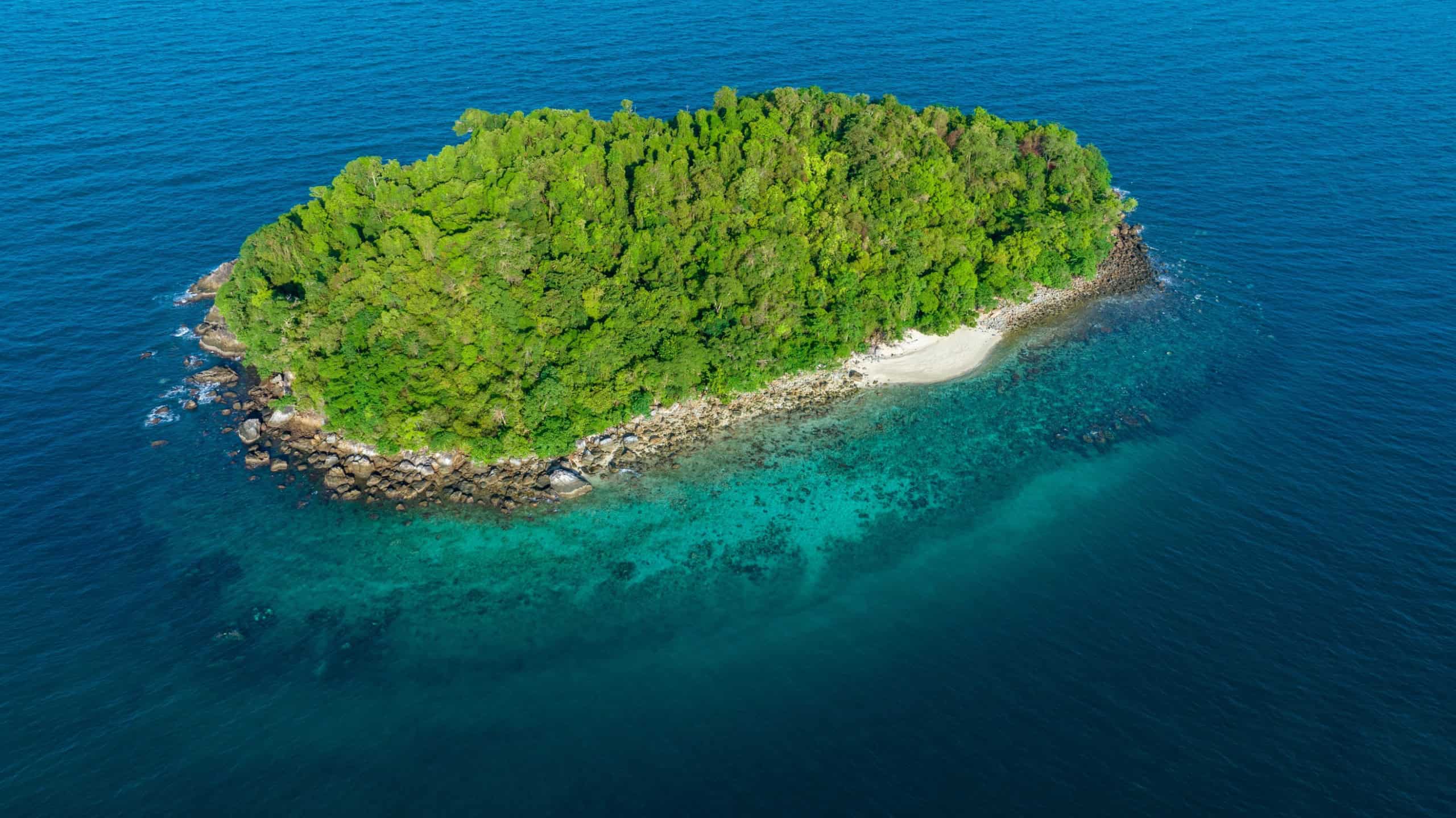 Seascape with small island. Blue sea surface from above, sea from a drone. Beauty of nature concept background. beautiful island
