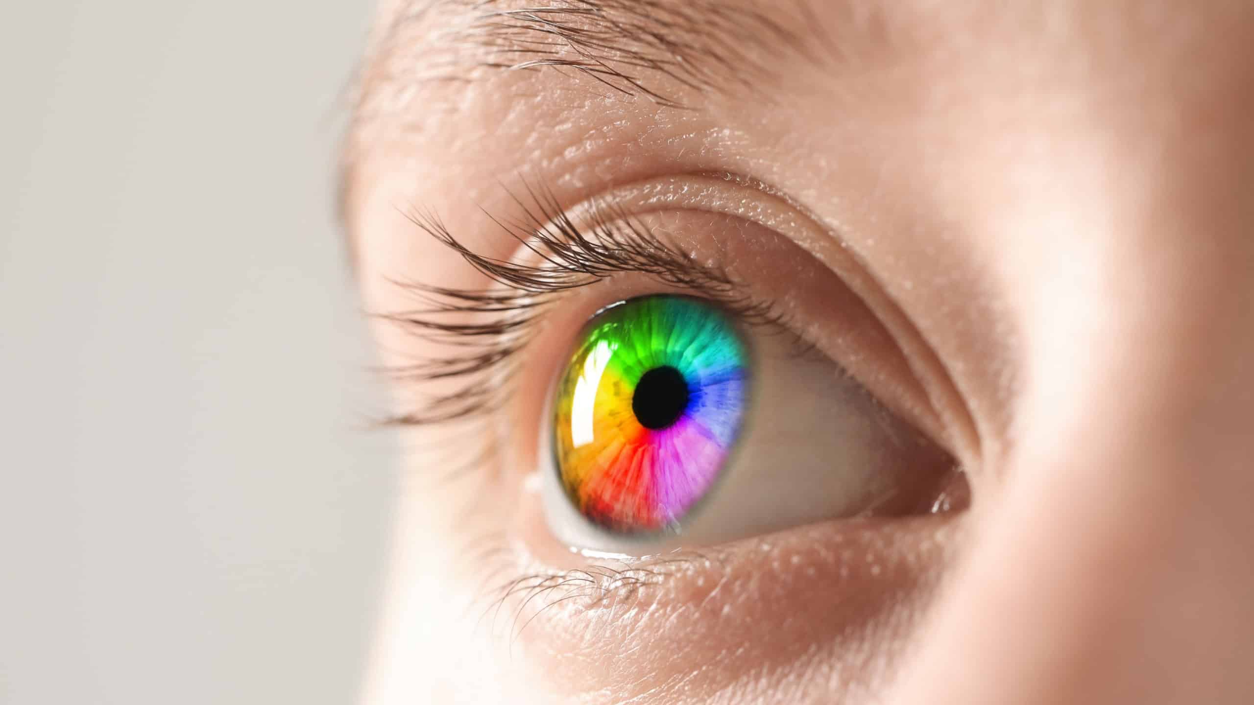 Woman's eye toned in rainbow colors, closeup