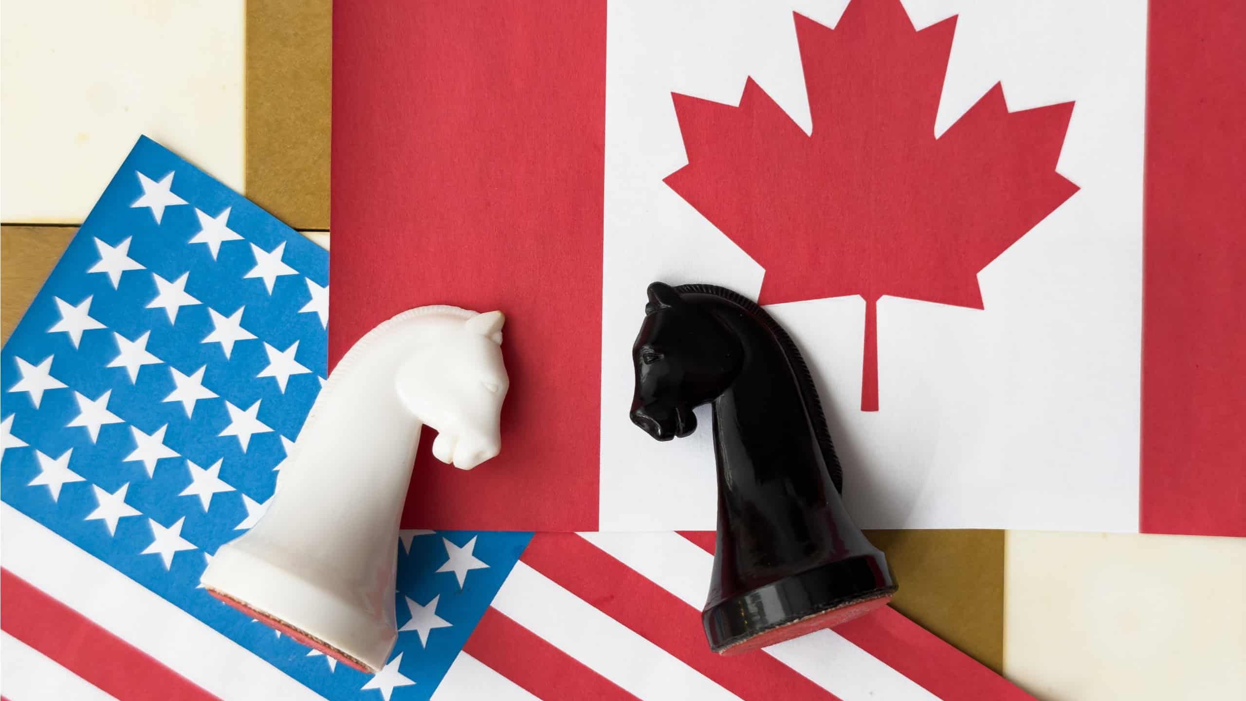 USA flag and Canada flag print screen on pawn chess with white background.It is symbol of tariff trade war tax barrier between United States of America and Canada.