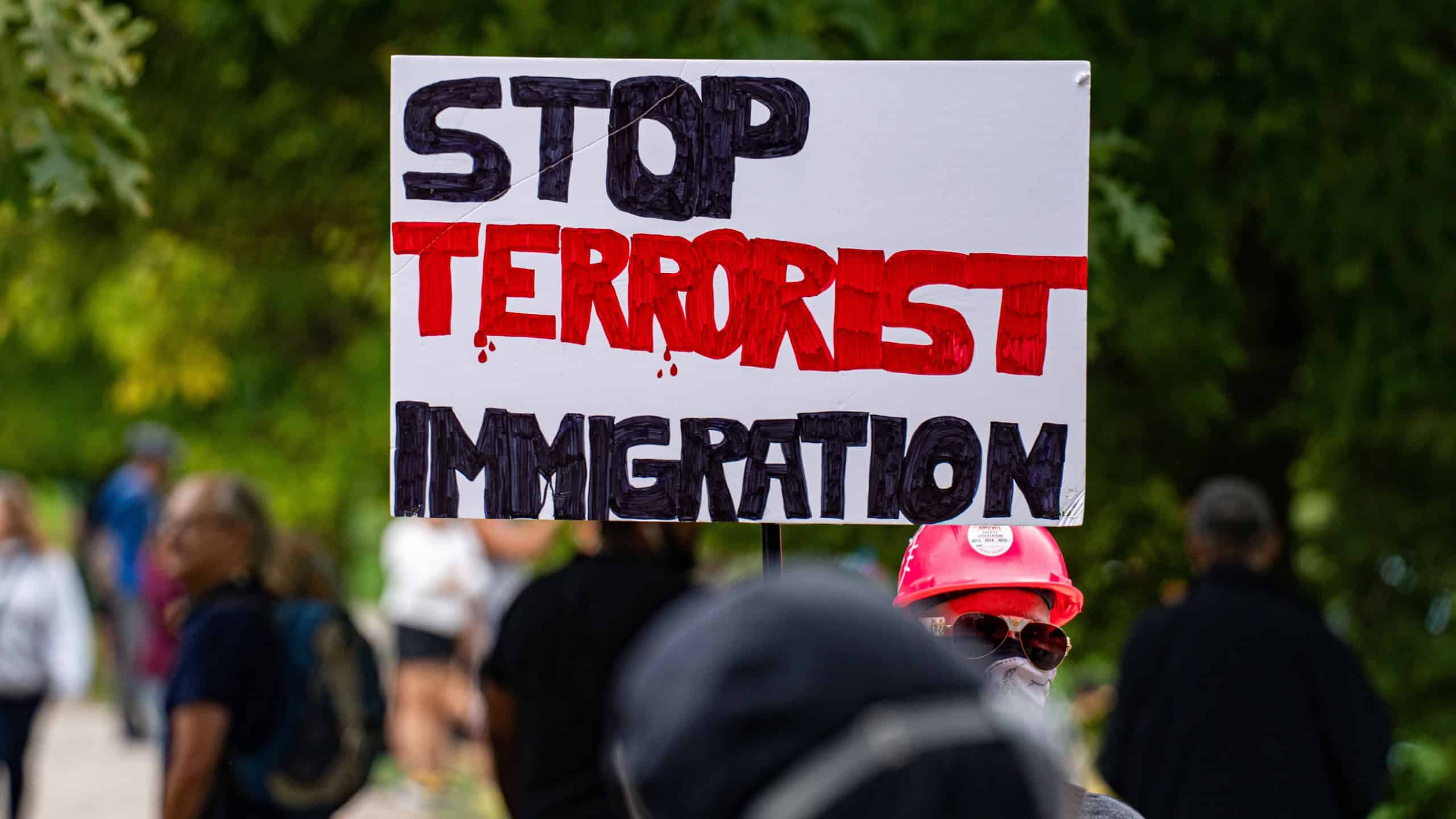 View of Stop Terrorist Immigration banner at anti-immigrant First Canada rally. Toronto, Canada - September 13, 2025.