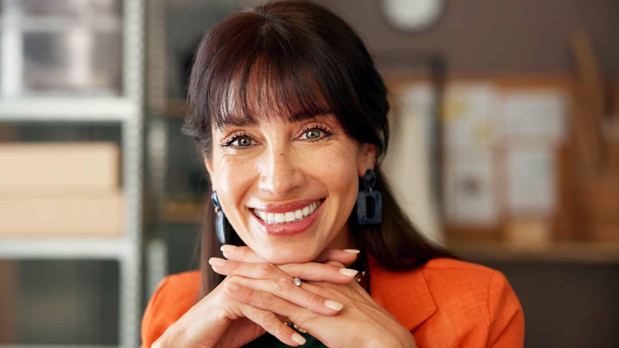 Portrait, ecommerce and smile with business woman for shipping, logistics and about us. Startup, entrepreneur and supply chain with mature person in office for distribution or procurement in Uk