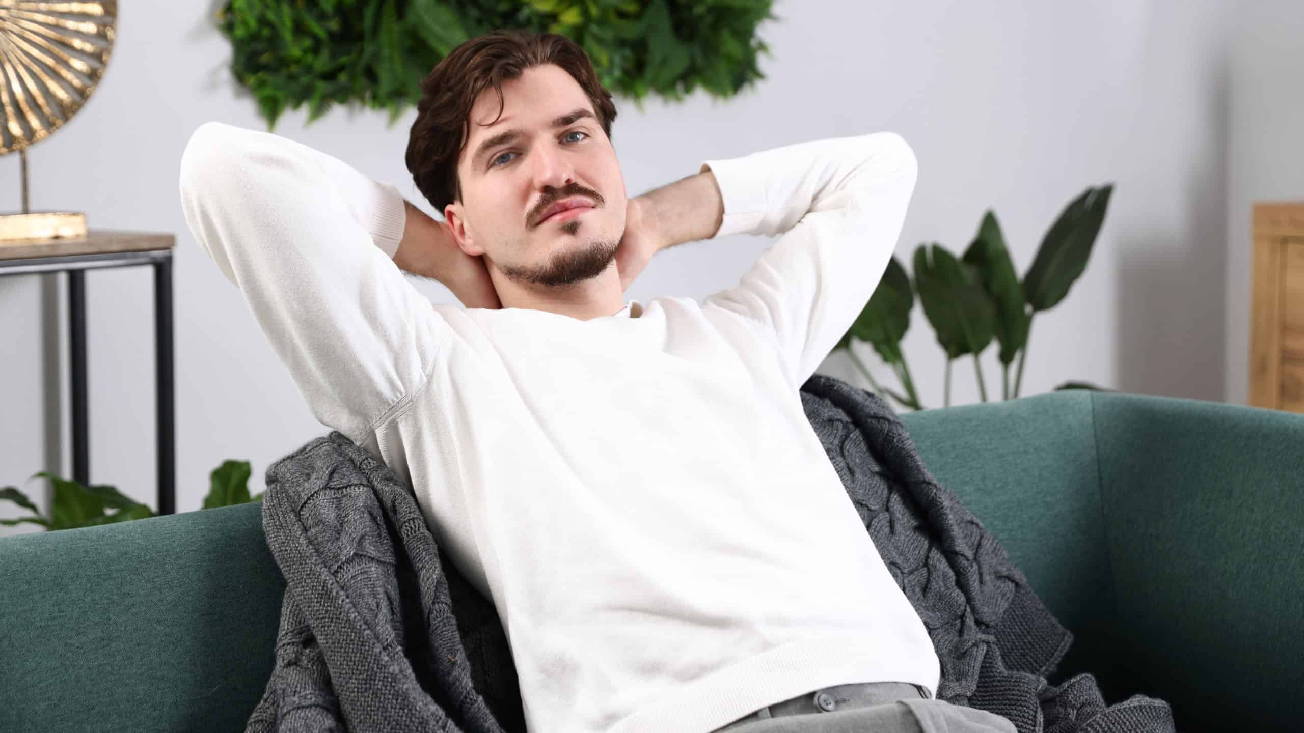 Man having rest on sofa at home